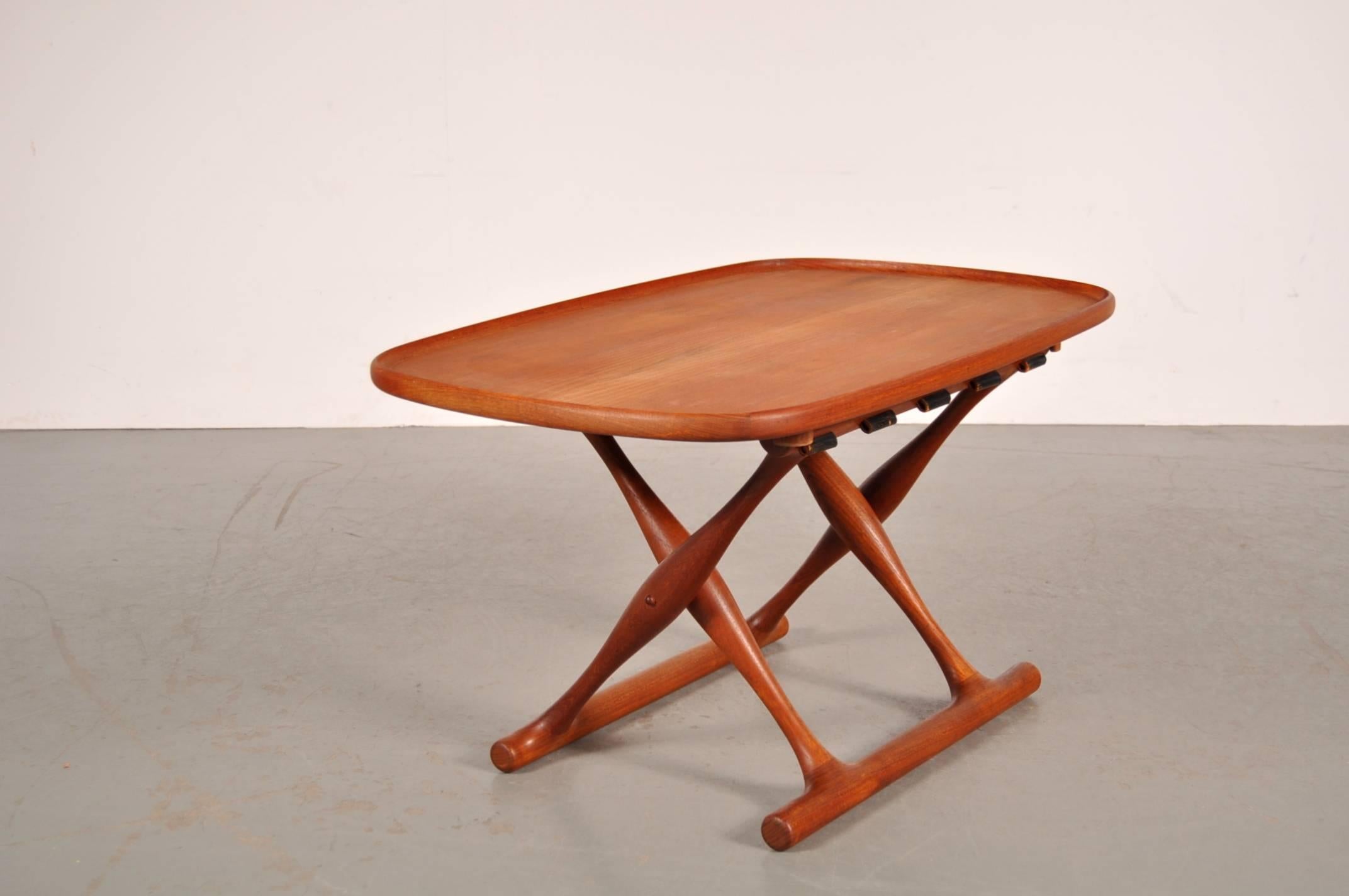 Beautiful folding stool with matching tray designed by Poul Hundevad for Domus Danica in Vamdrup, Denmark, circa 1950.

The stool is made from amazing quality teak wood with a thick, strong black leather upholstery. The leather is beautifuly