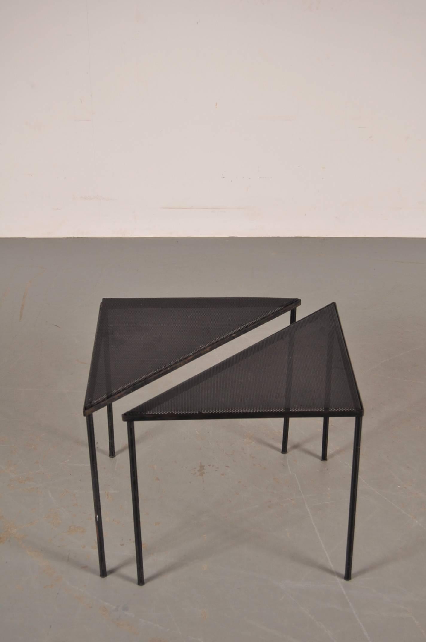 Stunning pair of side tables designed by Mathieu Matégot, manufactured by Artimeto in Soest, the Netherlands, circa 1950.

These eyecatching tables are made of high quality black metal with perforated tops, making them highly recognizable