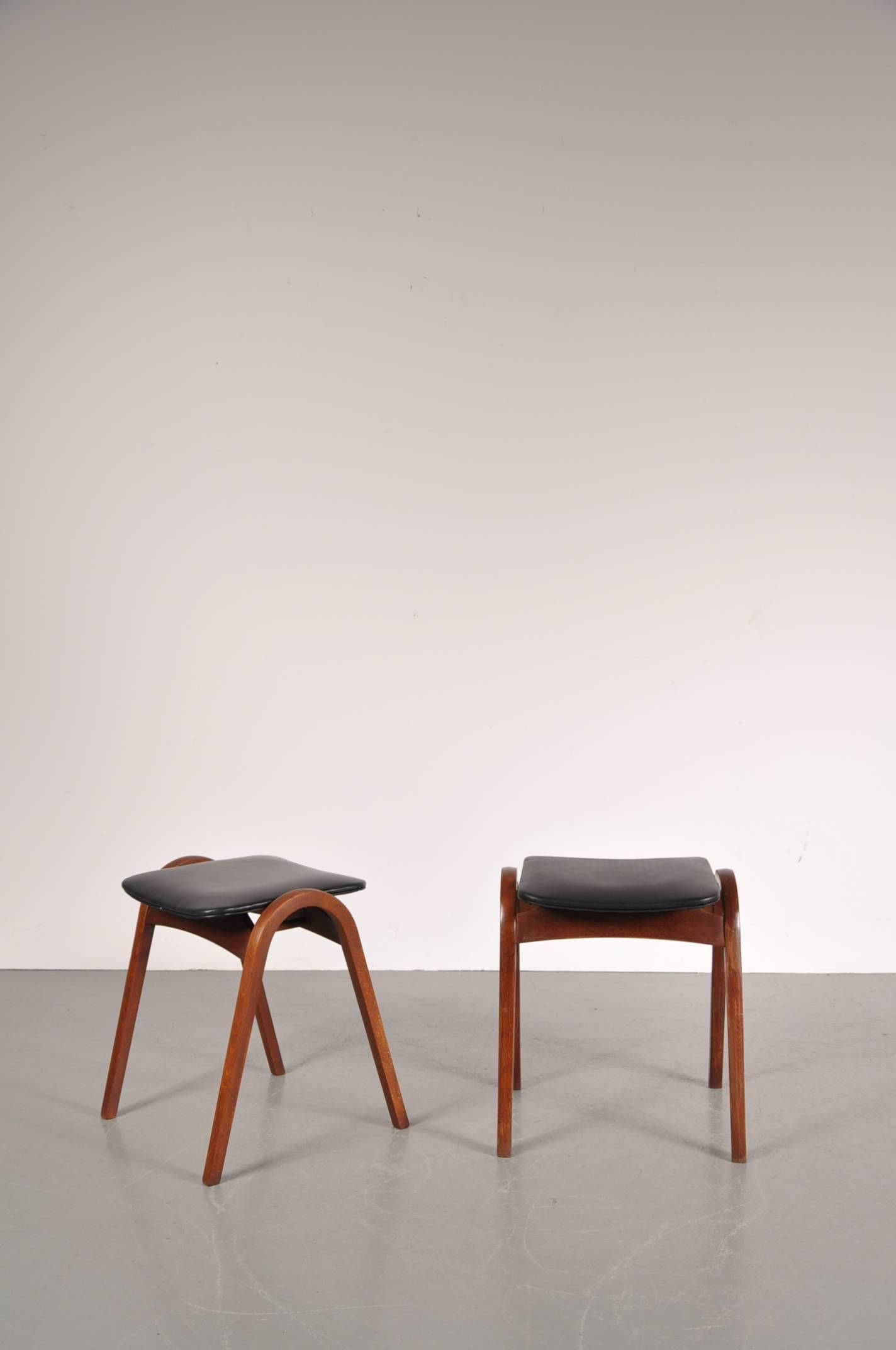 Iconic stacking stools designed by Isamu Kenmochi, manufactured by Tendo in Japan in 1958.

These beautiful, minimalistic stools are made of high quality bent beech wood with a lovely black vinyl upholstery.

When designing this stool,