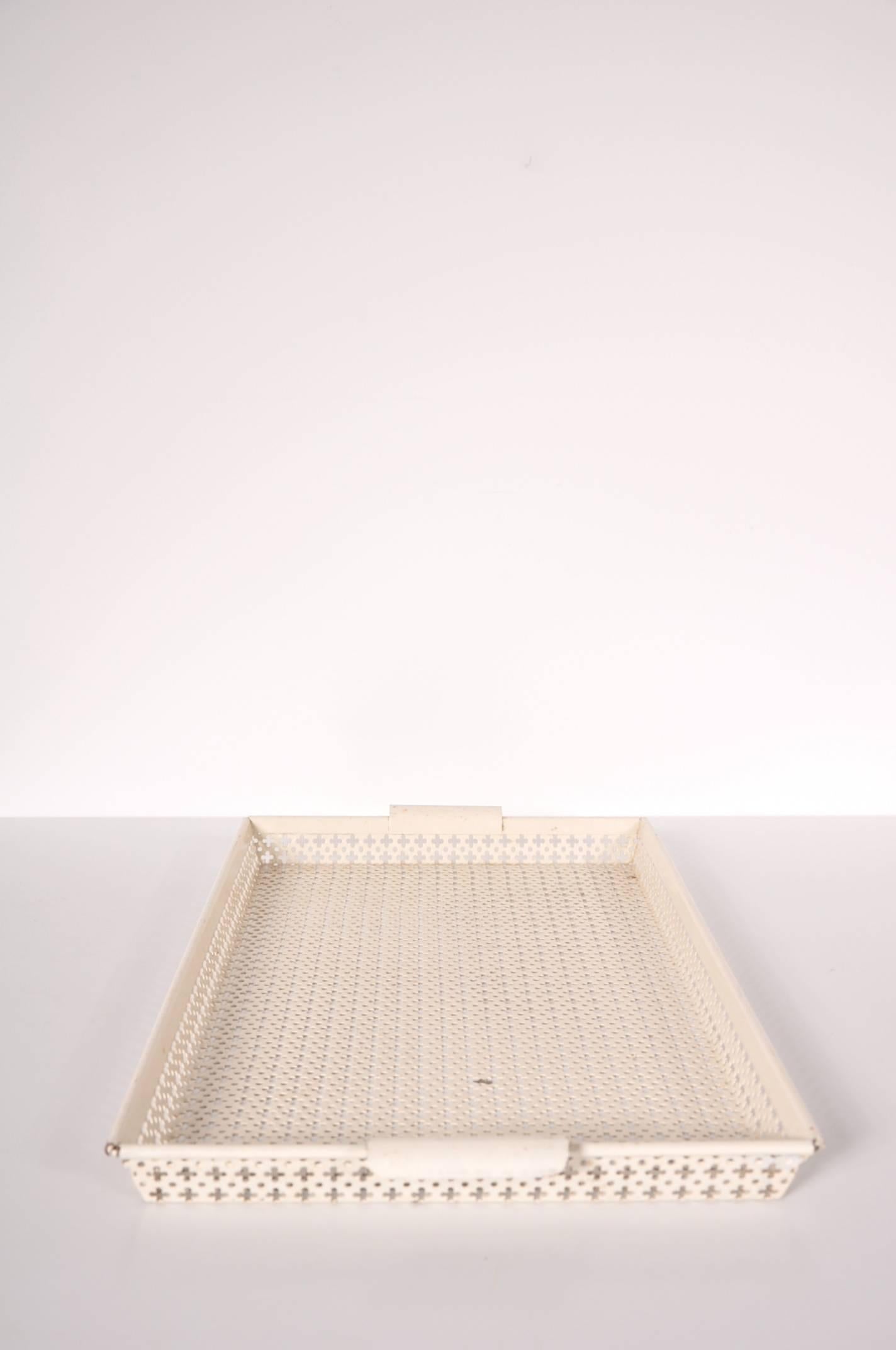 Beautiful perforated metal tray designed by Mathieu Matégot, manufactured by Ateliers Matégot in France, circa 1950.

This rare piece is crafted in the true Matégot style, made of white lacquered perforated metal with white metal grips.

In good