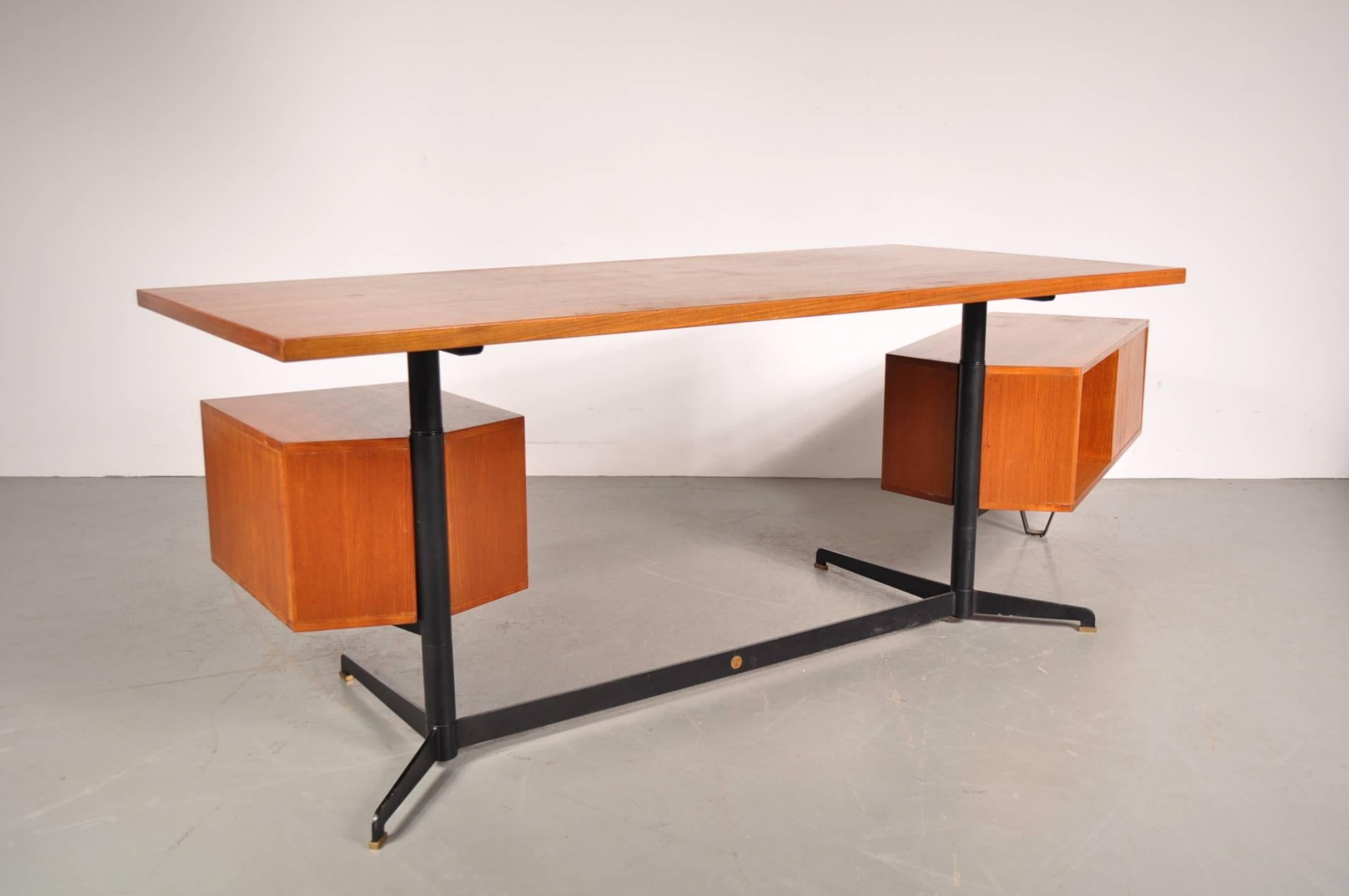 Amazing swivable desk model T95 designed by Osvaldo Borsani, manufactured by Tecno in Milan, Italy in 1952.

This eye-catching desk has a unique design with the integrated drawer being adjustable in position, making it a versatile piece that would