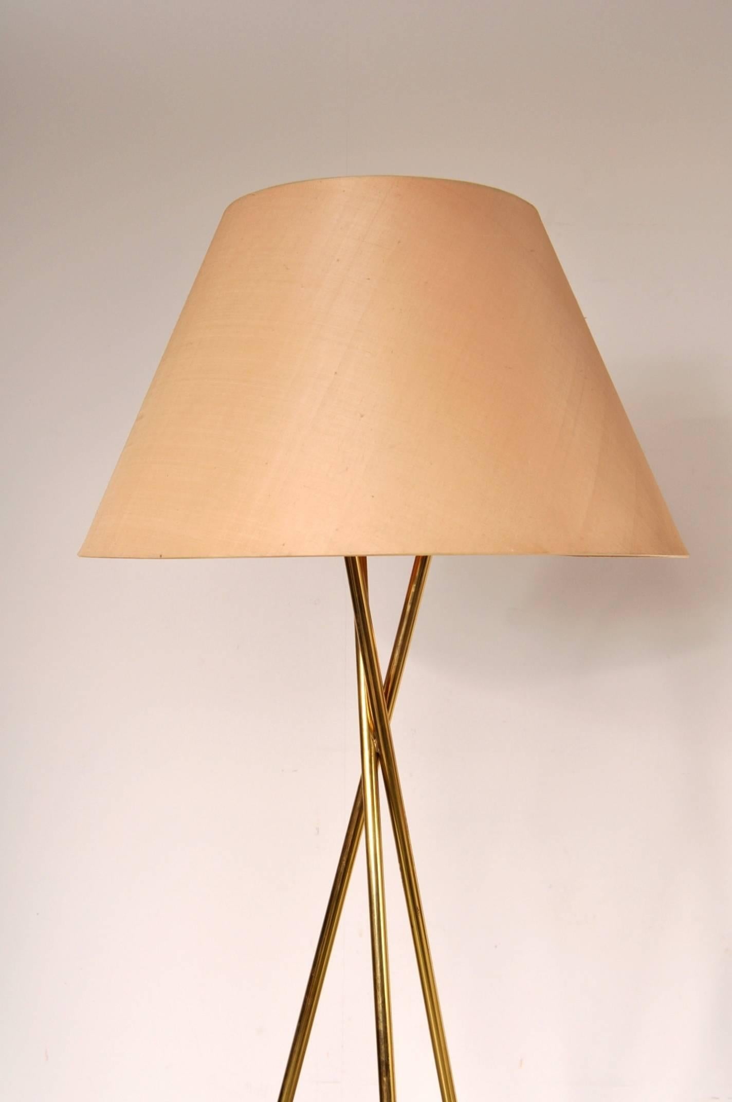 Luxurious set of two floor lamps, manufactured in the United States, circa 1960.

These beautiful lamps would make the absolute eye-catchers in any interior. The tripod legs are made from the highest quality brass and have a very nice shape,