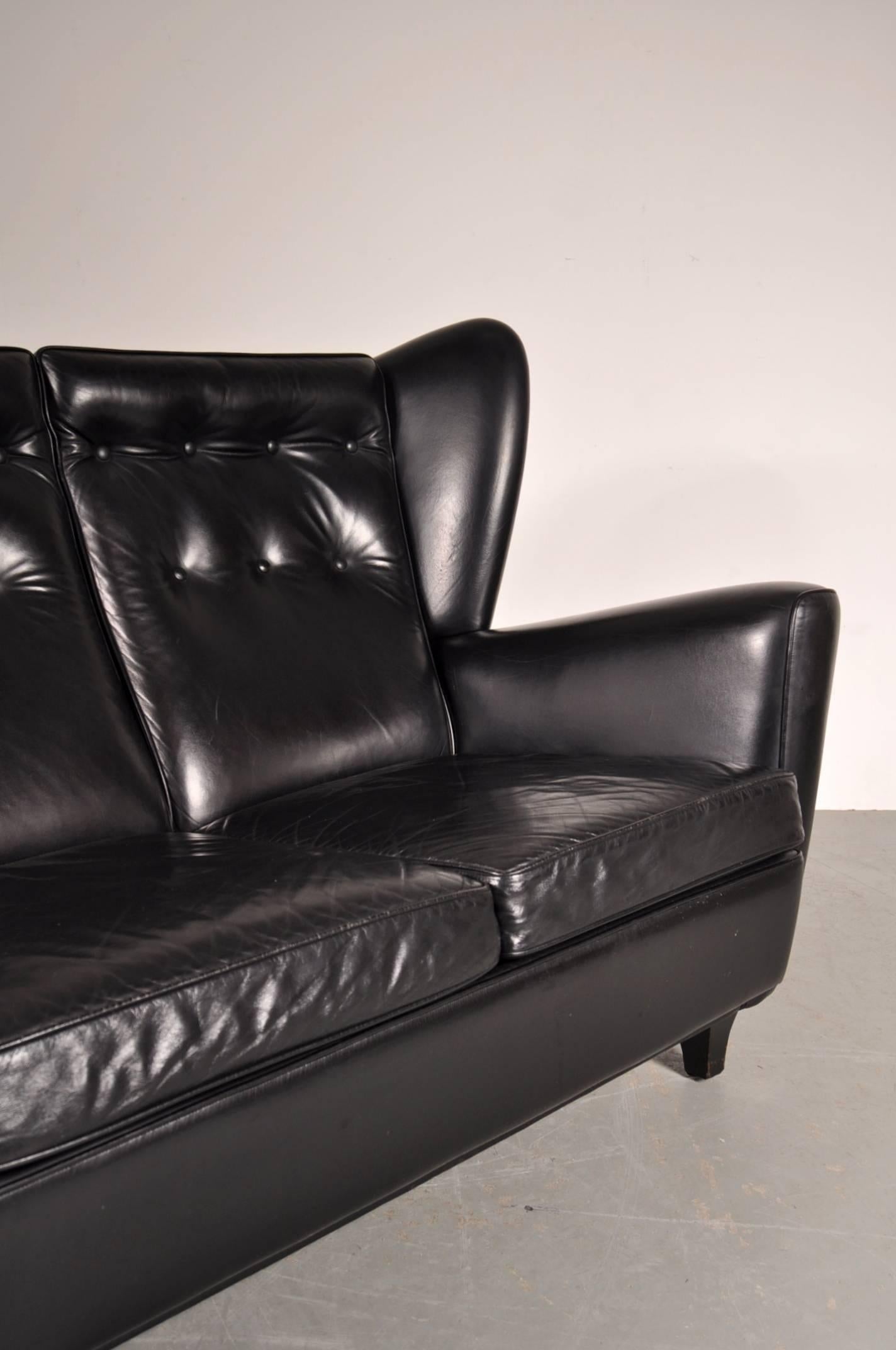 British Black Leather Wingback Sofa by Howard Keith, Uk, circa 1960s