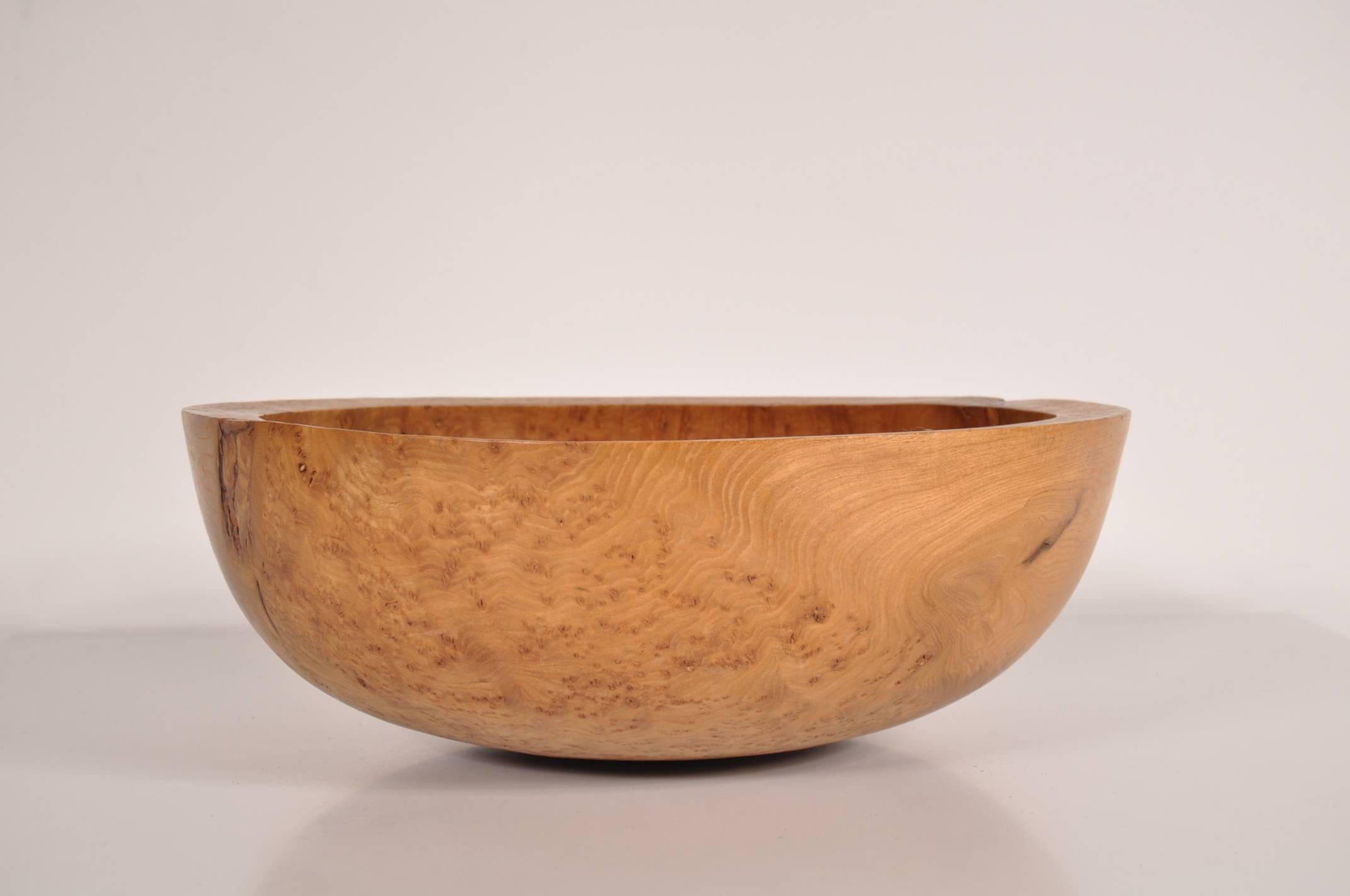 Beautiful signed bowl in burr elm, made by Anthony Bryant in the UK, circa 2000.

This wonderful piece was crafted from burr elm, which shows in the beautiful and unique patterns that remain in the wood. It has a more solid structure than most of