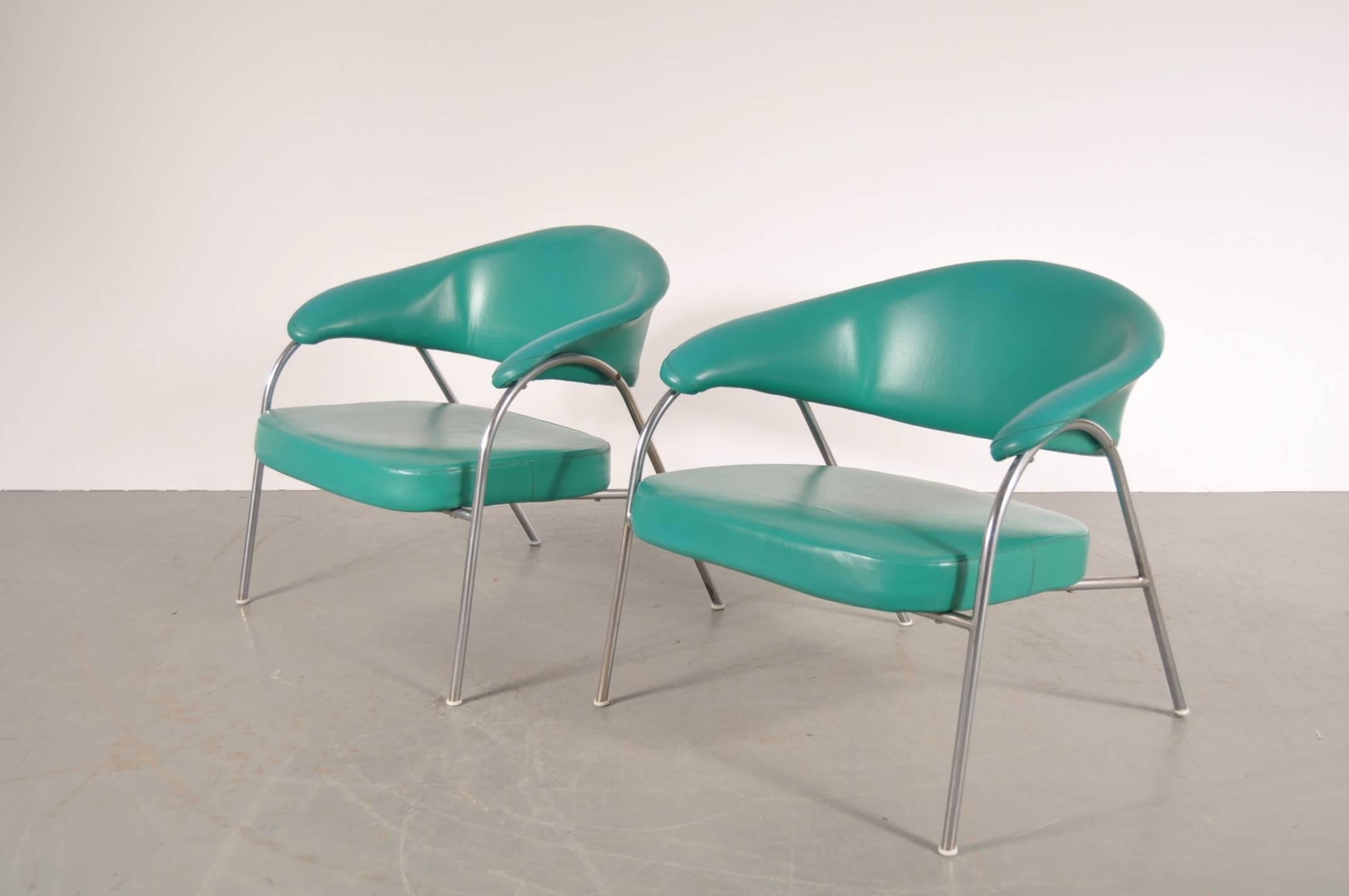 Unique pare of easy chairs produced by Arflex in Italy, circa 1960.

These rare chairs are upholstered in a very appealing turquoise skai upholstery. Together with the chrome metal base, this gives the chairs a very own style. It fits in the