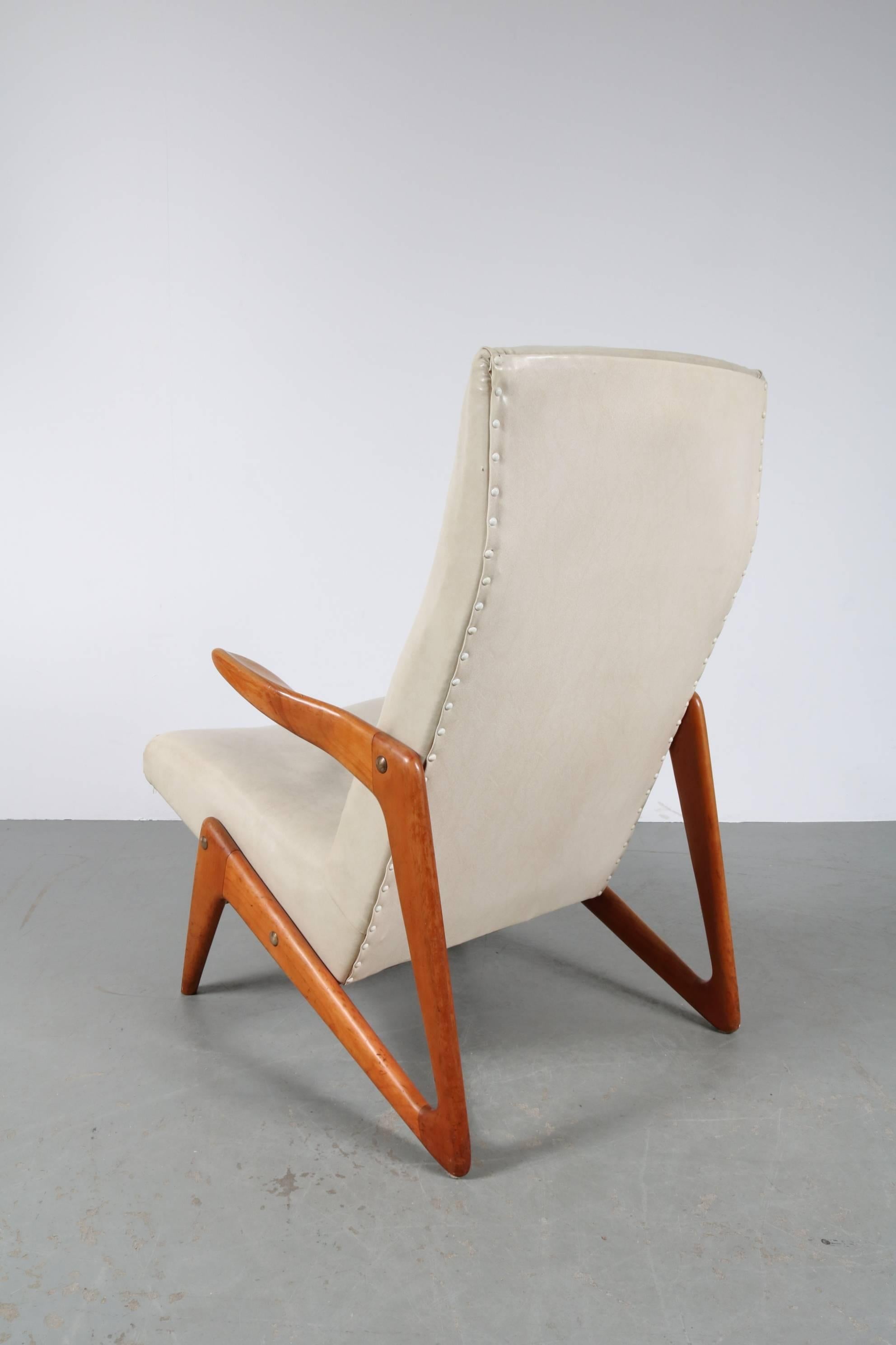 Eye-catching lounge chair, attributed to Alfred Hendrickx for Belform in Belgium, 1950s.

The chair has a very nicely designed walnut wooden base, creating a unique appearance from every angle. The comfortable seat is uphostered in the original