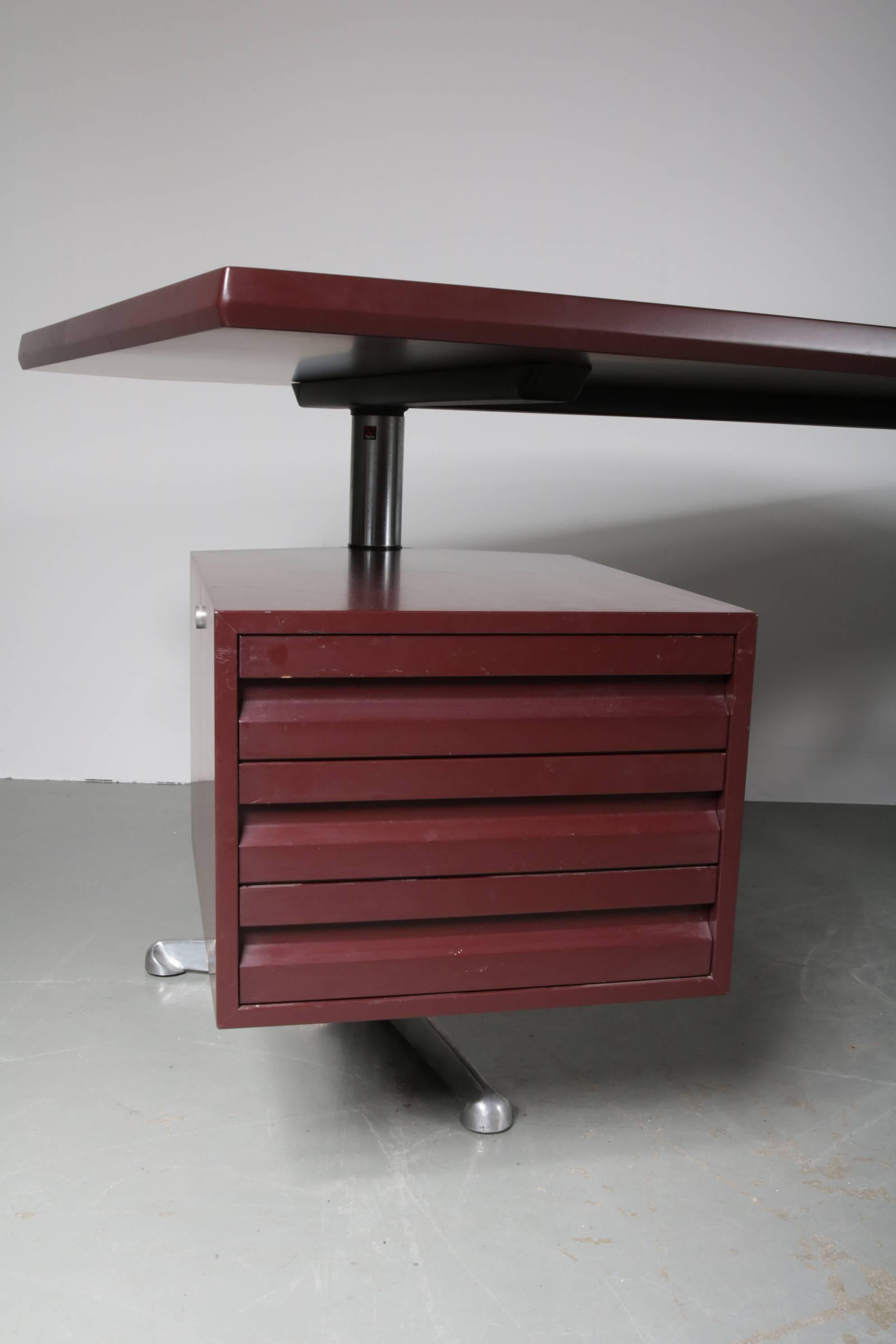 Beautiful large executive desk designed by Osvaldo Borsani, manufactured by Tecno Milano in Italy, circa 1950.

This eye-catching desk has a unique design with the integrated drawer that is adjustable in position, making it a versatile piece with