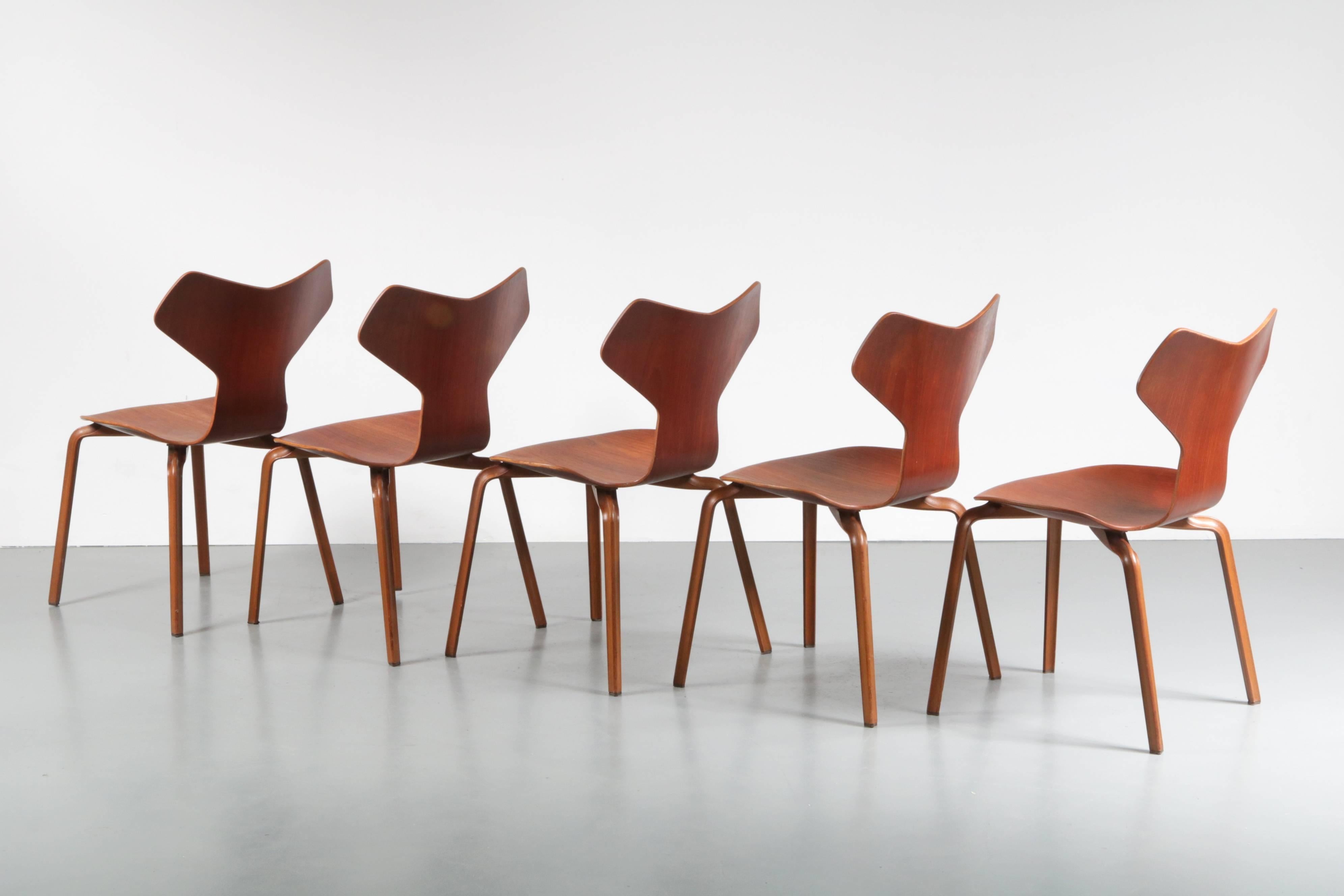 Beautiful set of five Grand Prix chairs (model 3130) designed by Arne Jacobsen, manufactured by Fritz Hansen in Denmark 1957.

The chairs are completely made of high quality teak wood, giving them a nice luxurious appearance. This model is named