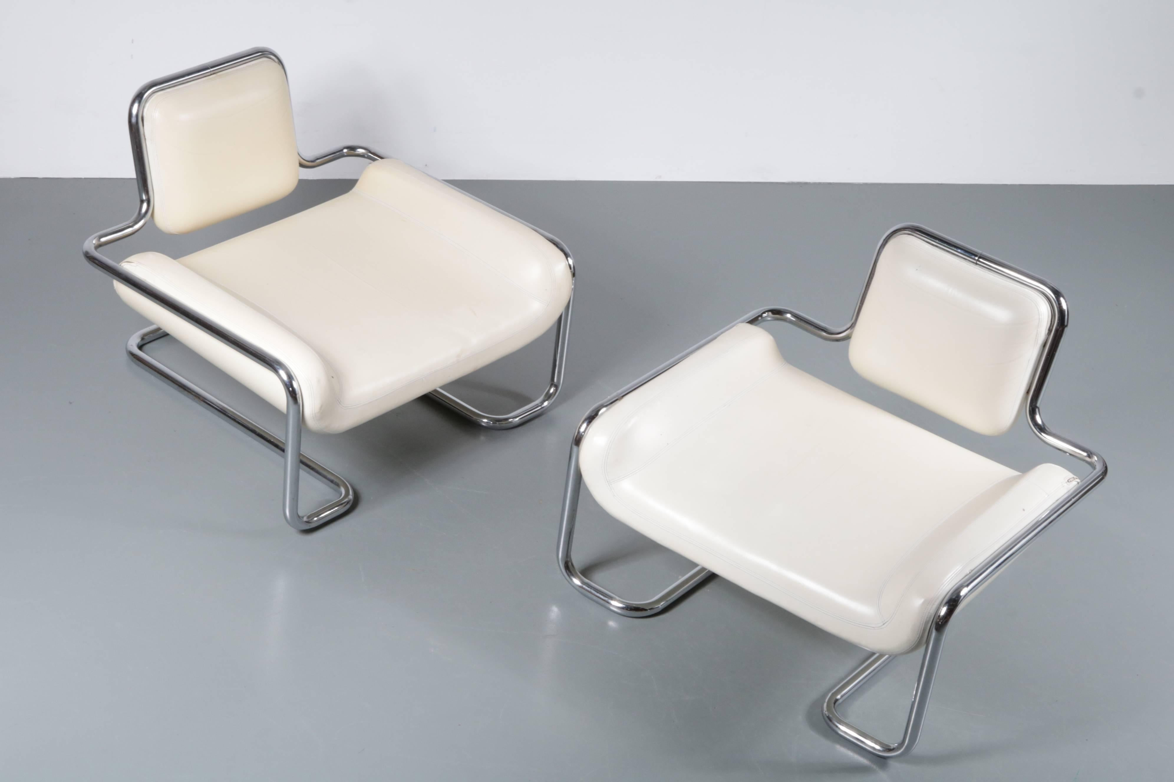 An eye-catching pair of Limande Chairs designed by Kwok Hoï Chan, manufactured by Steiner, France in 1971.

These beautiful chairs have a smooth design with a high quality chrome plated one-piece tubular frame. They are completely original and have