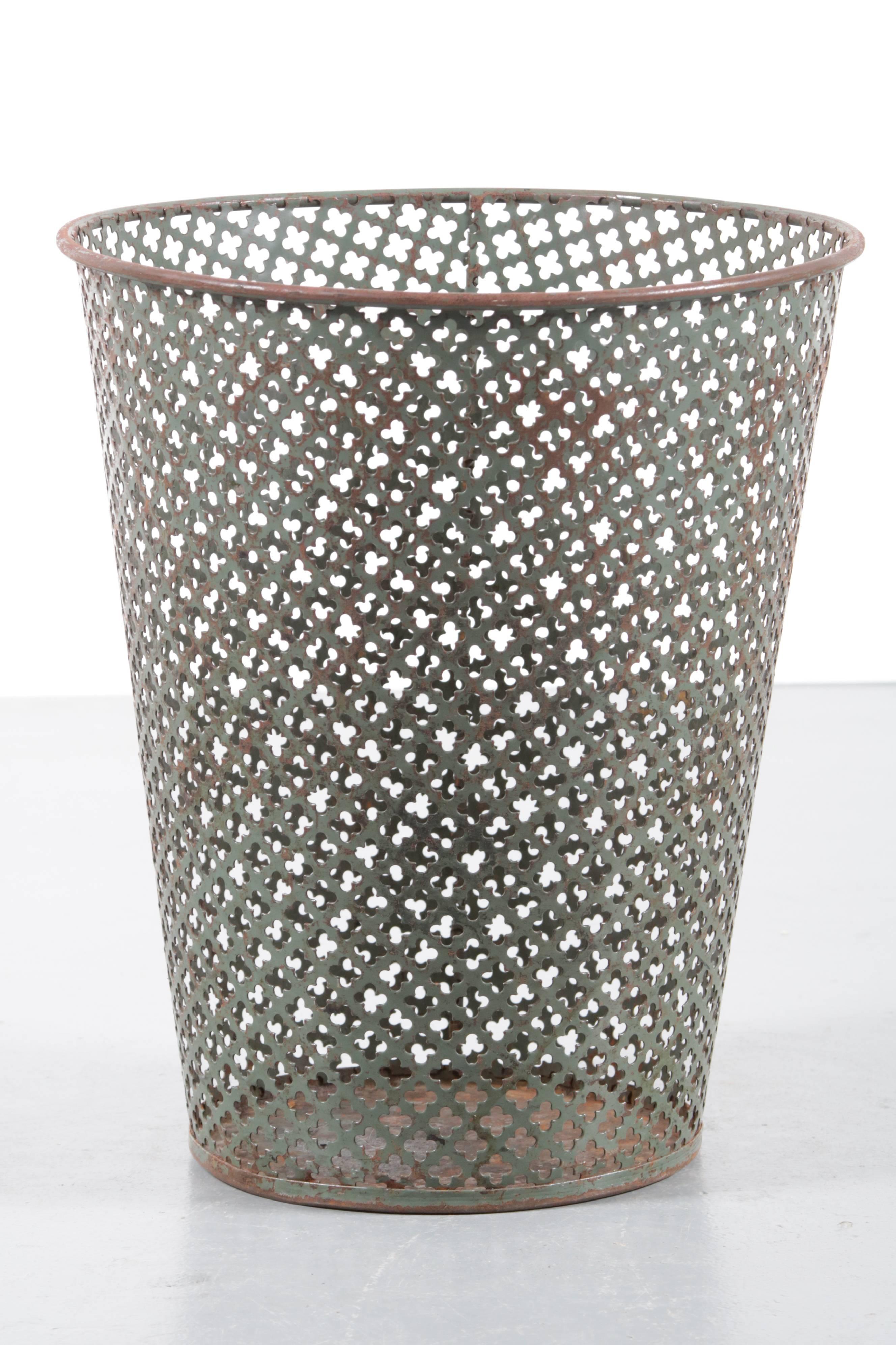 A rare trash bin / paper basket designed by Mathieu Matégot, manufactured by Ateliers Matégot in France in the 1950s.

We have several in stock, which is a very unique find! The bins are made of high quality perforated metal, making them iconic