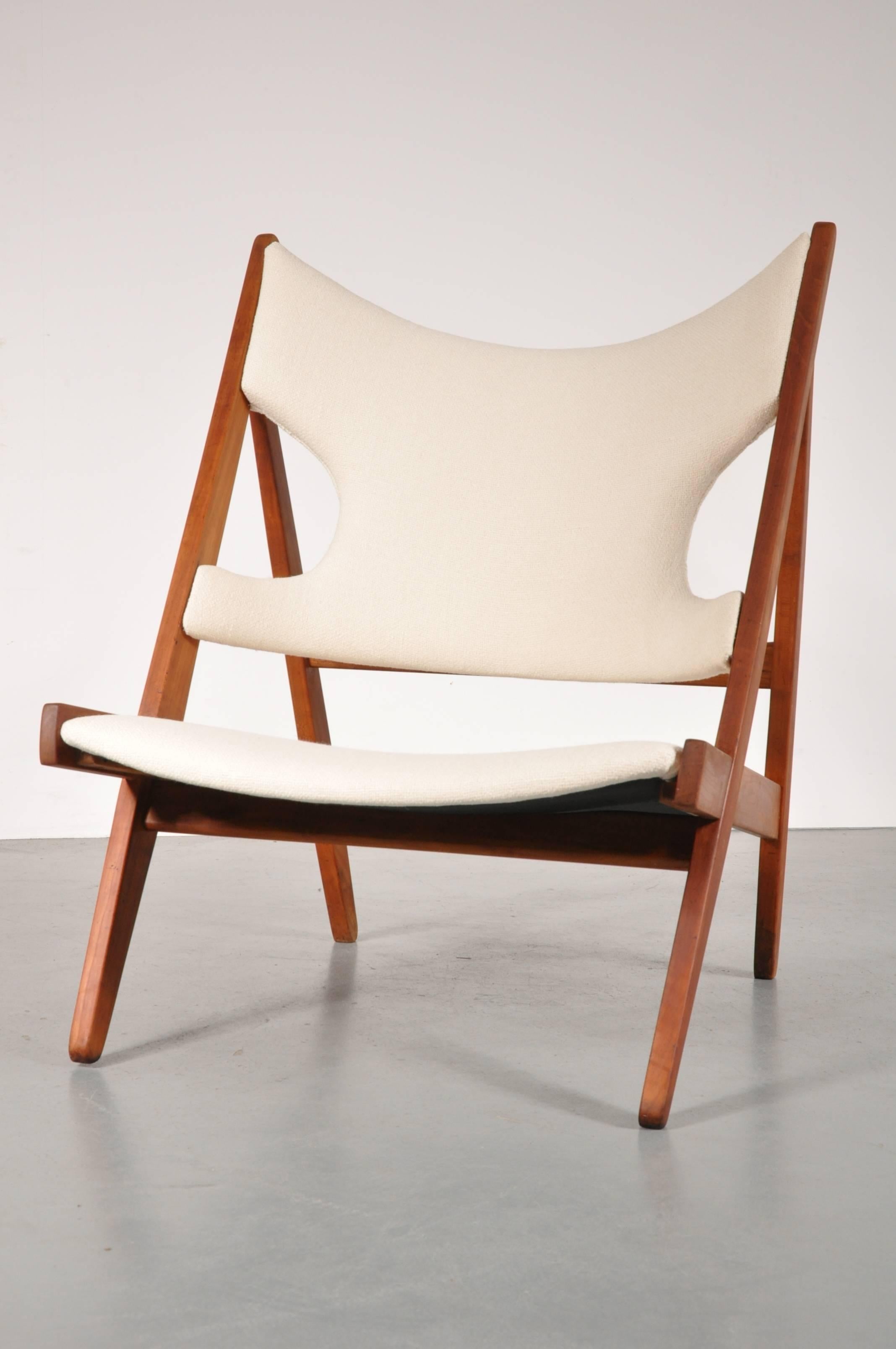 A very rare knitting chair designed by Ib Kofod Larsen, manufactured by Christensen and Larsen in Denmark, circa 1950.

This chair is very rare, as only a very few pieces have been produced. This piece has a high quality waxed ash wooden base,
