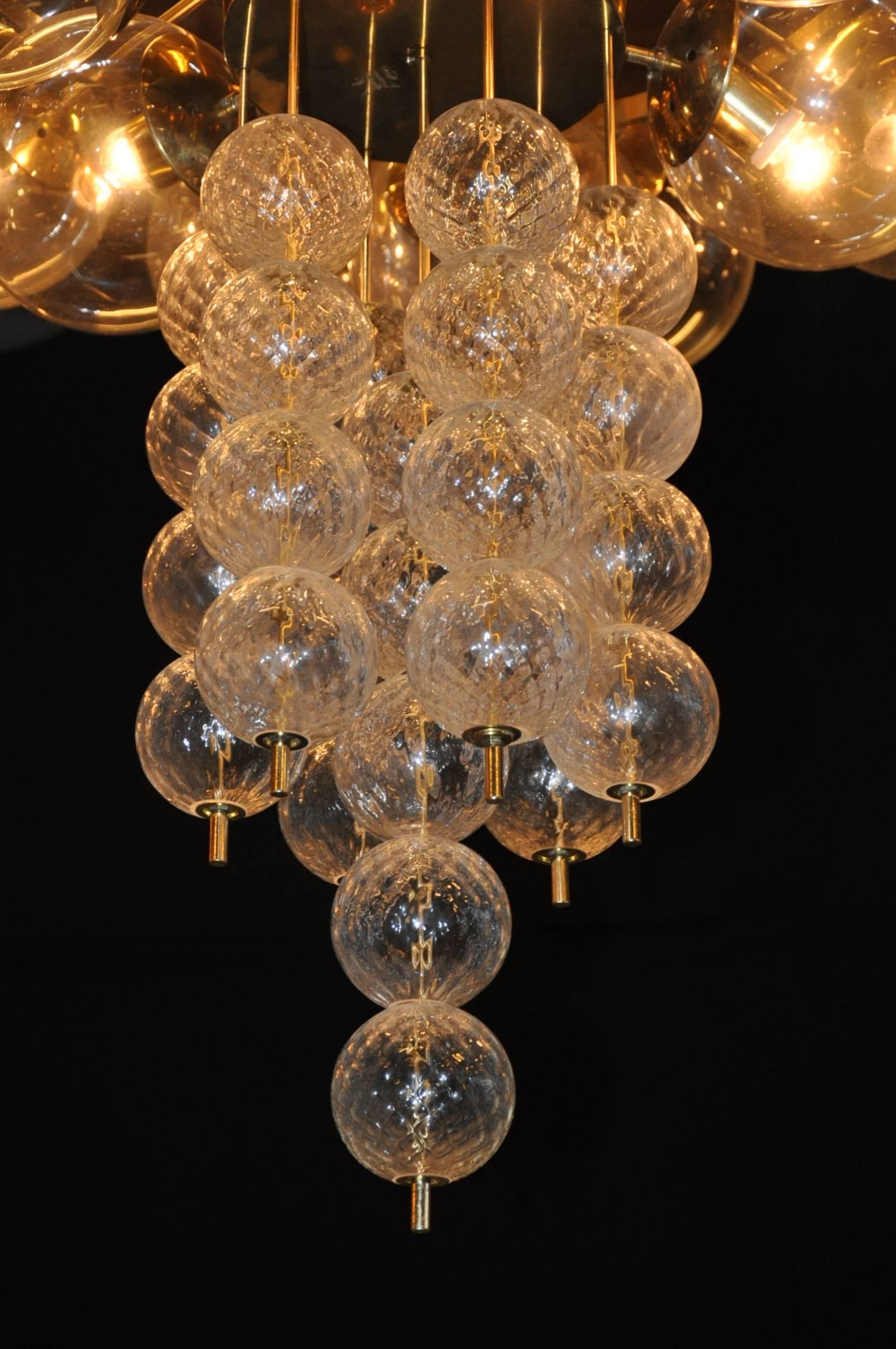 An extremely large chandelier manufactured in the Czech Republic, circa 1960.

This impressive piece is made of high quality handblown glass balls. The balls holding light bulbs are made of beautiful clear glass, the lower decorative balls have a