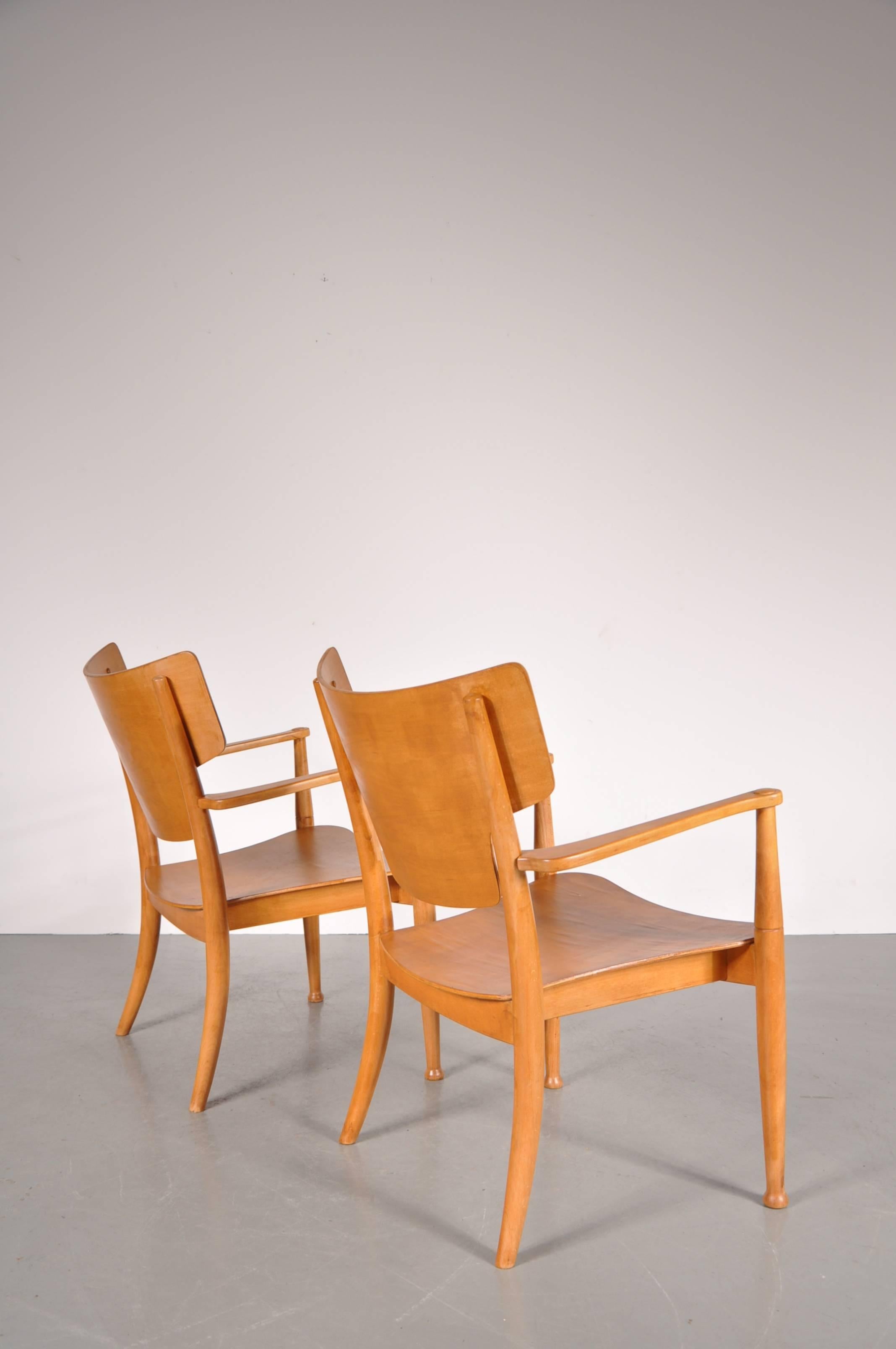 Beautiful pair of Portex easy chairs by Peter Hvidt and Orla Molgaard-Nielsen, manufactured in Denmark around 1940.

They are completely made of high quality beech, crafted with a nice eye for detail.

In good original condition with minor wear