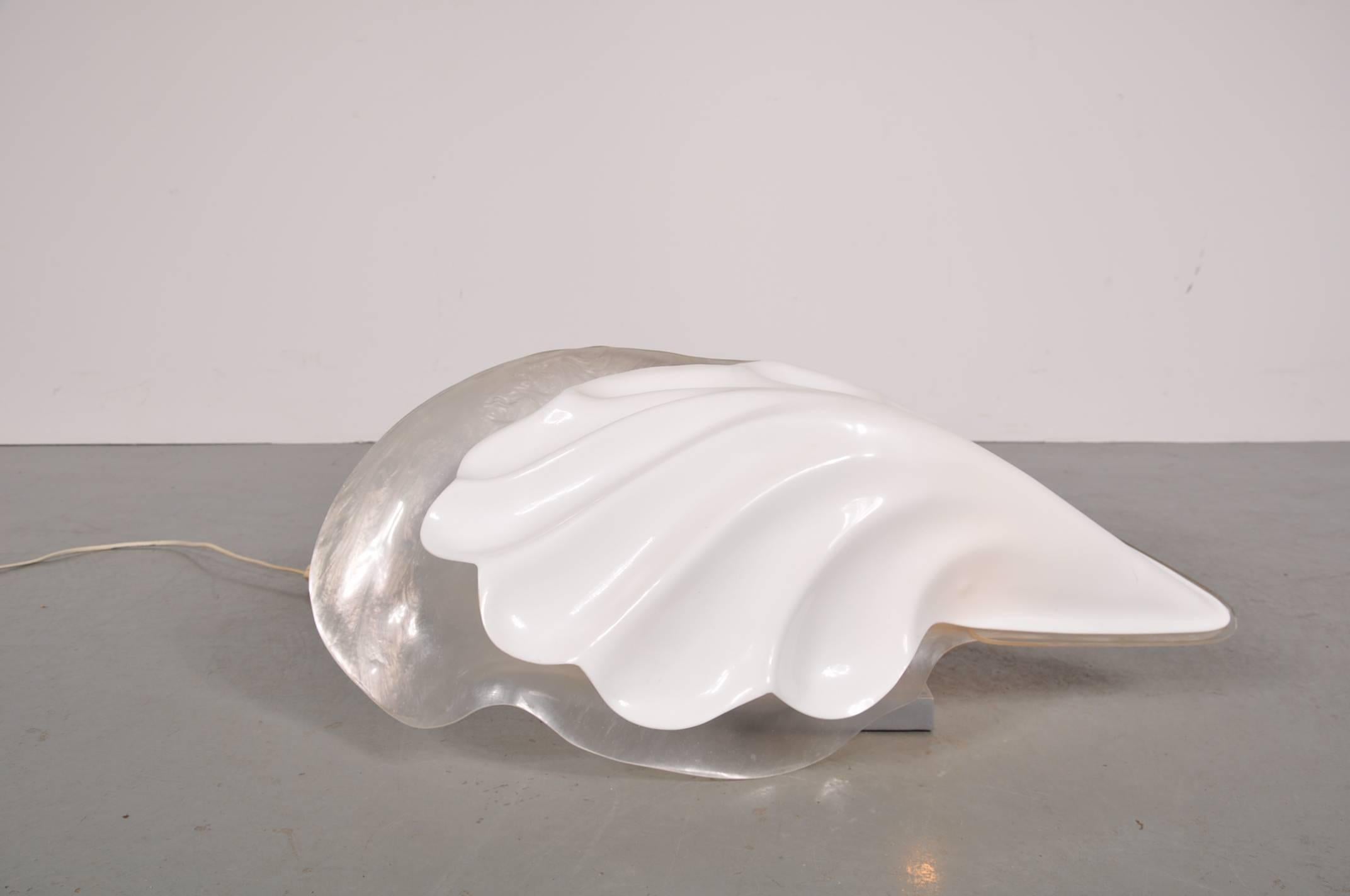 Beautiful shell table lamp by Rougier, manufactured around 1970.

This eye-catching piece has a high quality acrylic hood and grey metal base, giving it a beautiful appearance. It is signed Rougier on the base.

In good original condition with