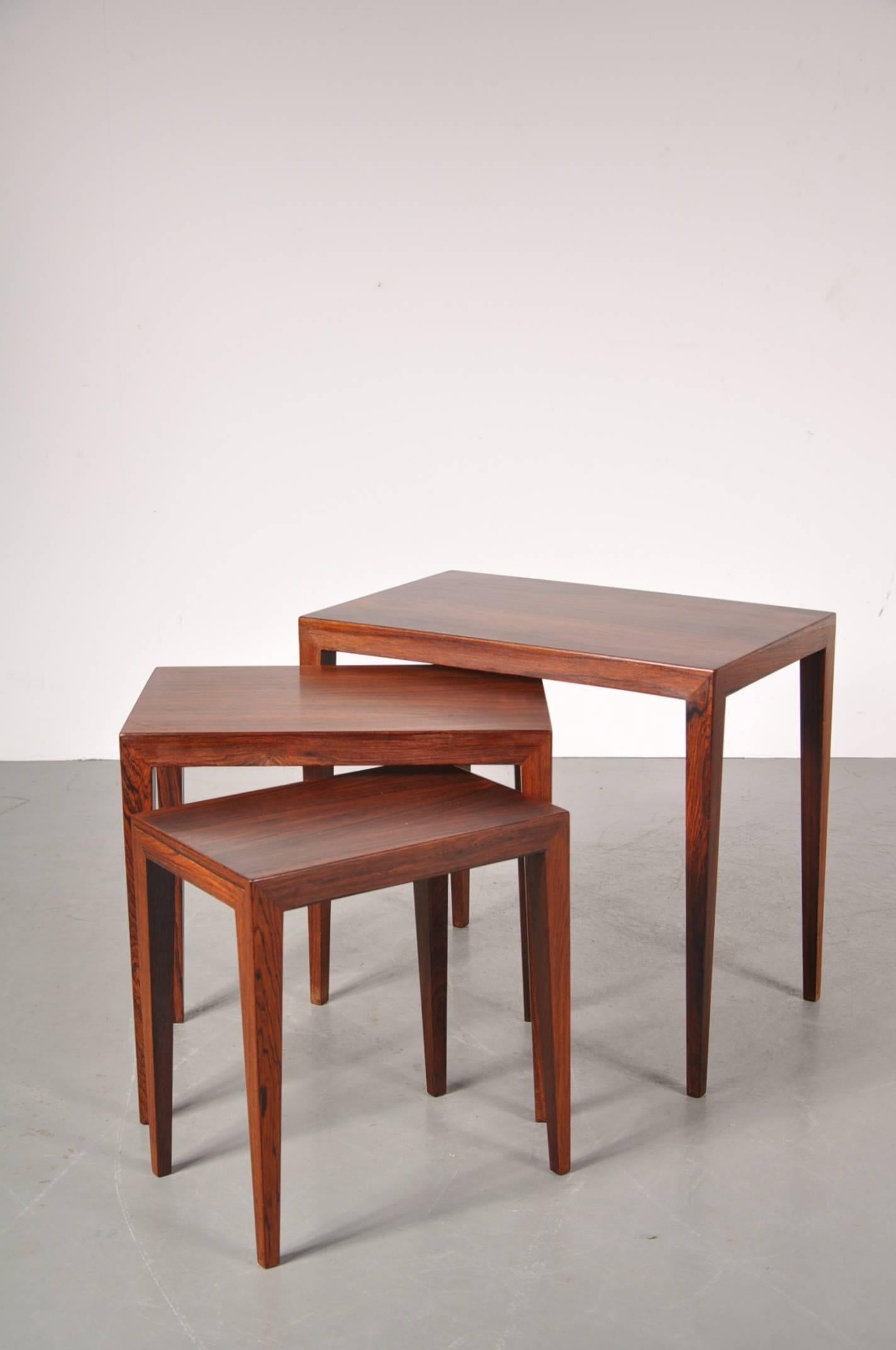 Beautiful set of three nesting tables by Severin Hansen, manufactured by Haslev Mobelsnedkeri, circa 1960.

These eye-catching tables are made of the highest quality rosewood. They would make a wonderful addition to any modern/Scandinavian