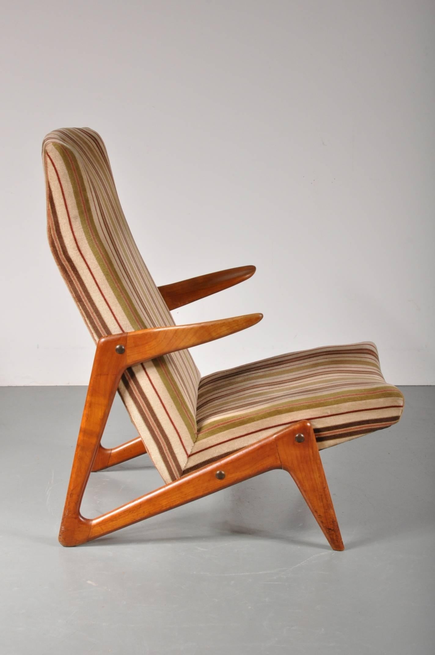 Eye-catching lounge chair, attributed to Alfred Hendrickx for Belform in Belgium, 1950s.

The chair has a very nicely designed walnut wooden base, creating a unique appearance from every angle. The comfortable seat is upholstered in the original