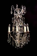 A silver plated and crystal birdcage chandelier