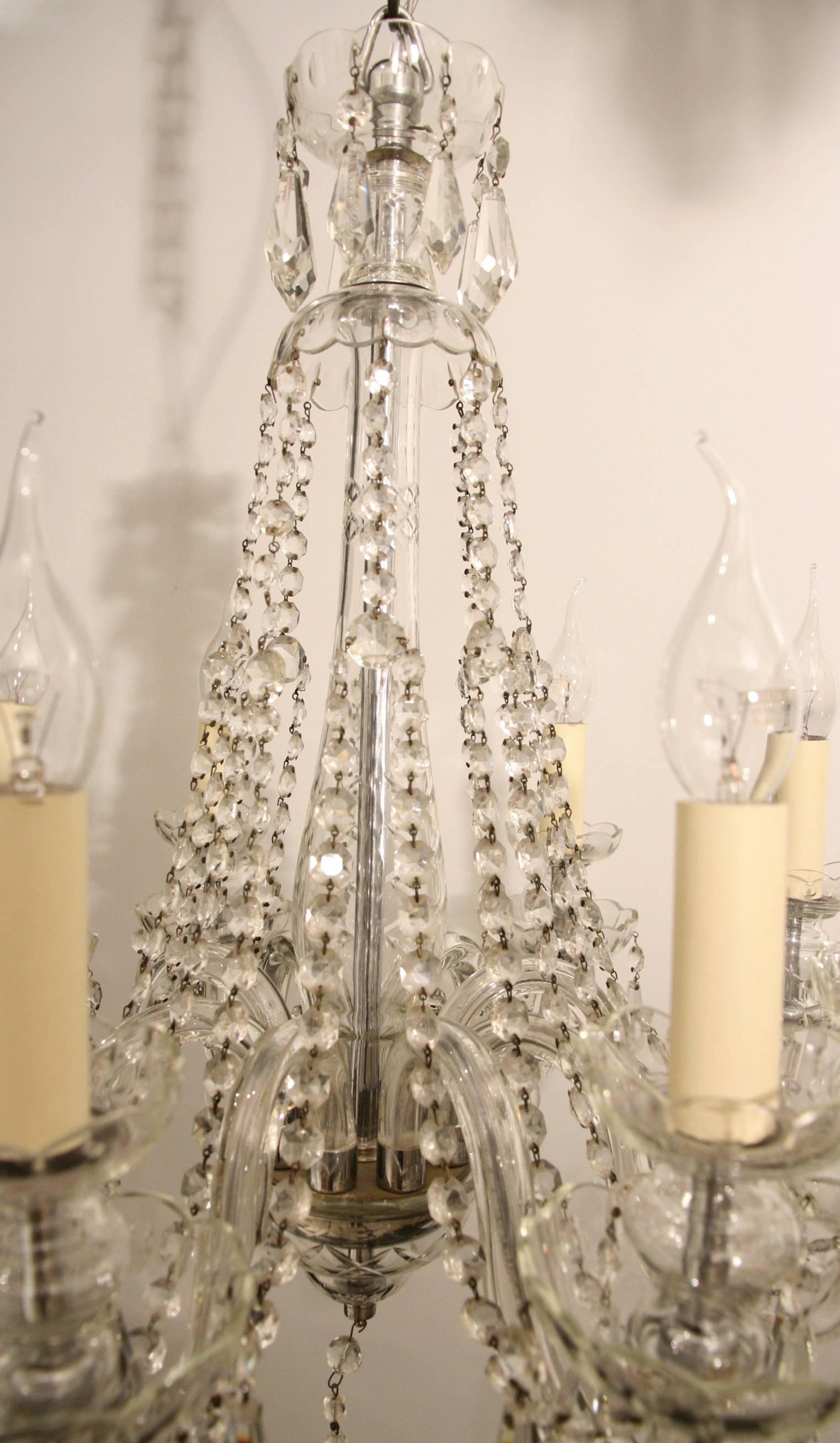 A well-proportioned cut glass, eight-arm chandelier.
