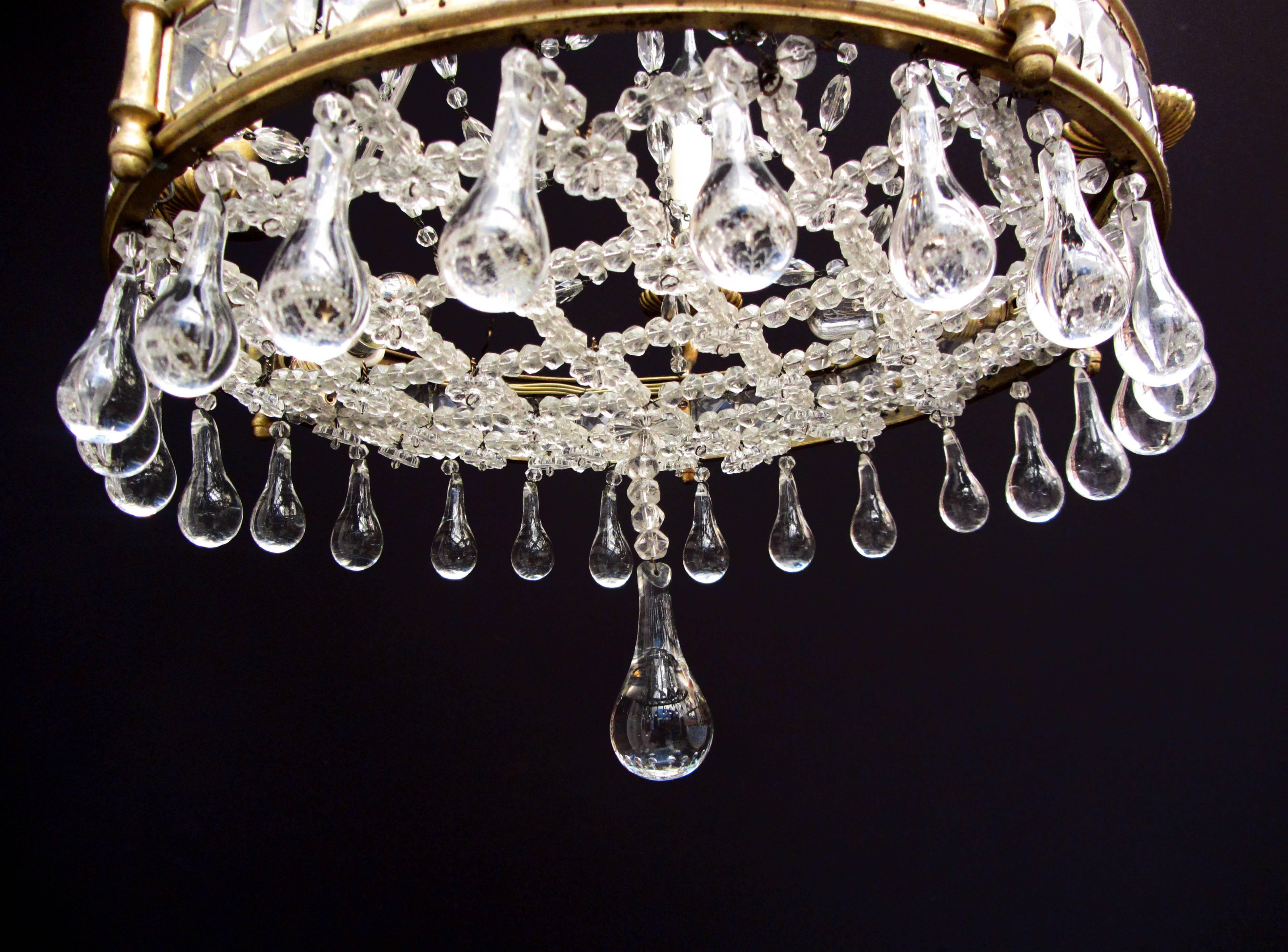 A gilt brass and cut-glass drop and bead chandelier.