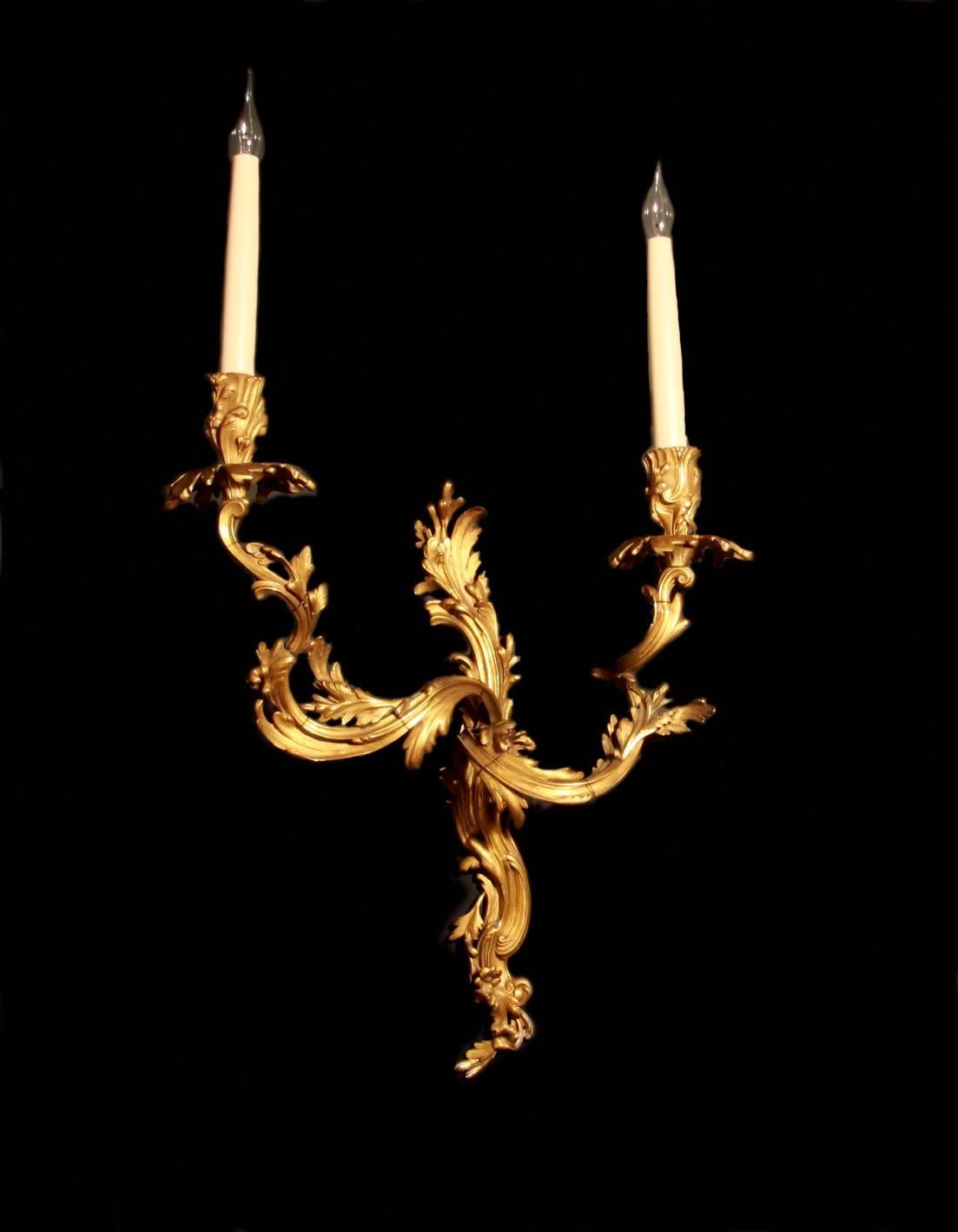 A pair of fine quality, gilt bronze, Louis XV style, five-arm wall lights. French mid-19th century. Professionally wired with French candles.