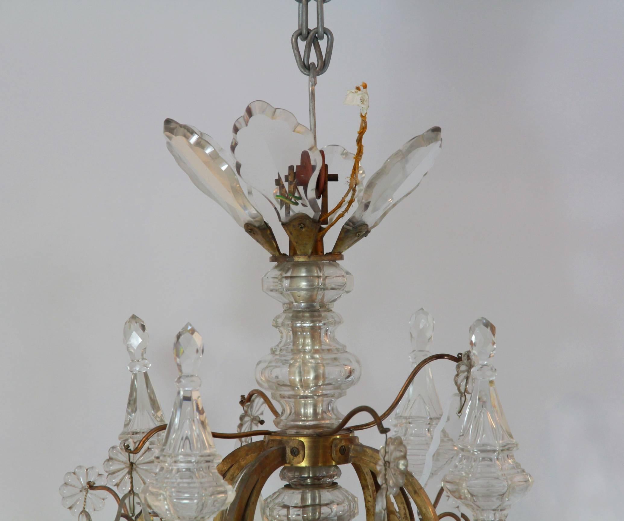 A pair of superb 19th century, French, 18th century style, cage chandeliers, of a good scale with beautifully hand cut facetted plaques suspended with small glass rosettes in the form of daisies, of varying shapes and sizes, all original. Comprised
