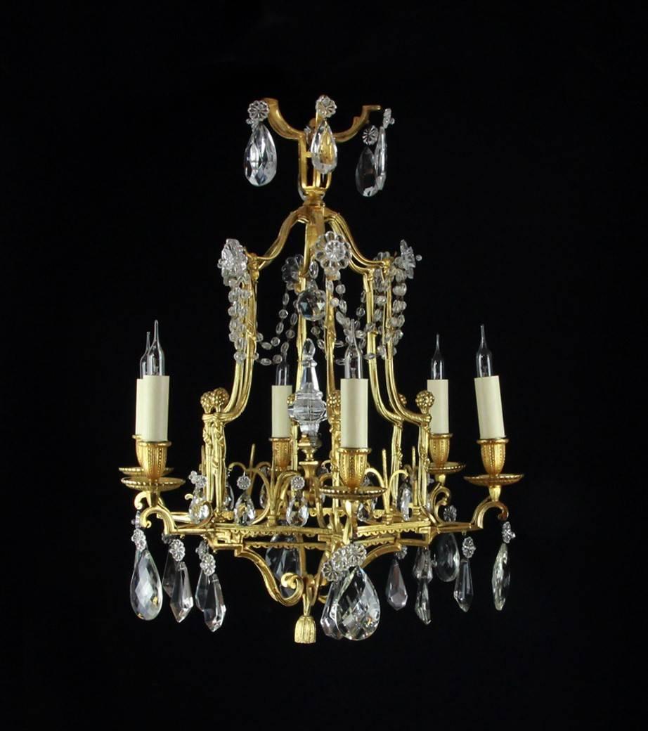 A rare and attractive pair of pagoda style small chandeliers with a beautifully built bronze cage emulating six arms and terminating in the Rope tassel. The main frame with small miniature bunches of flower finials and the top of the pagoda hung