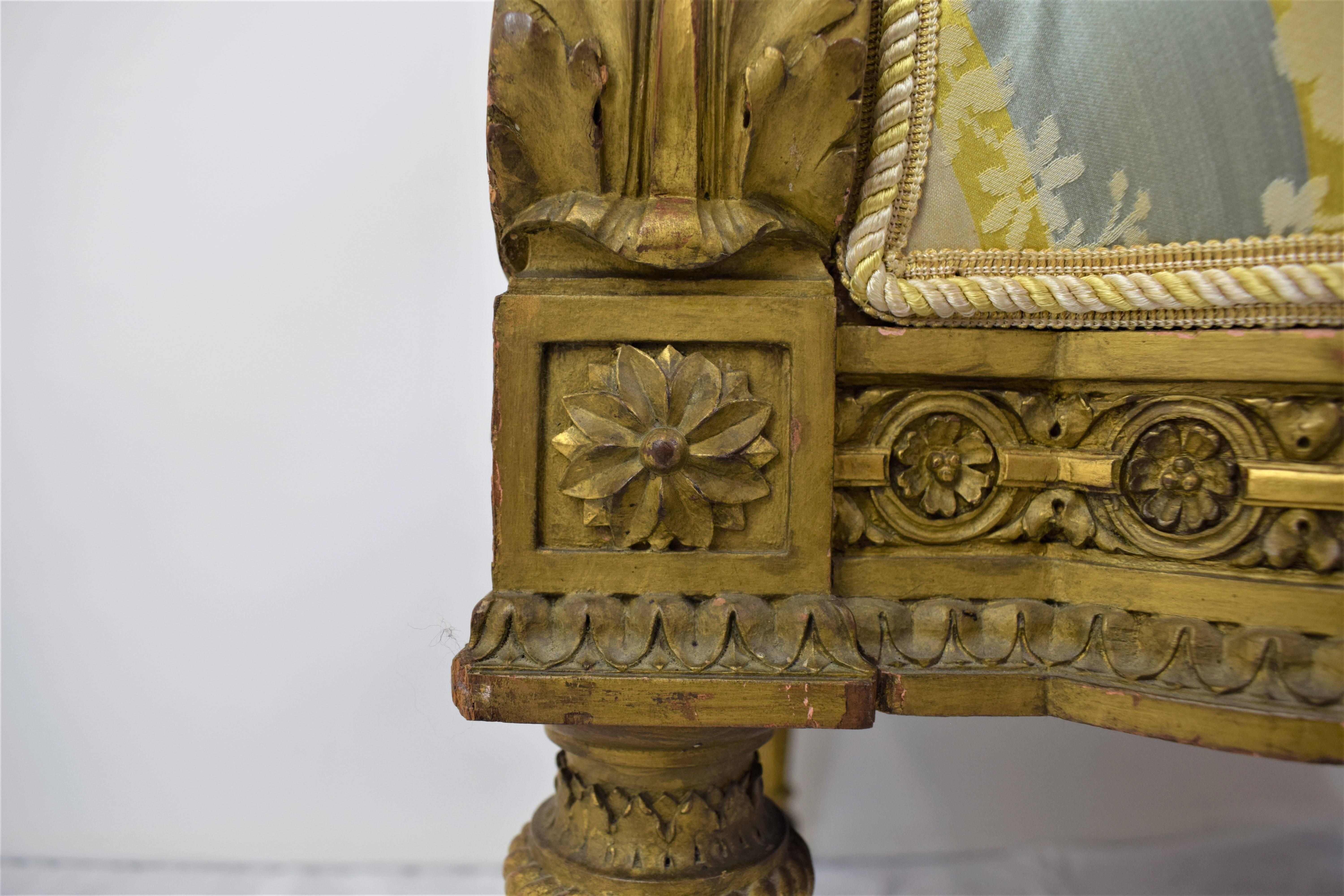 A set of finely carved imperial gilded armchairs in the style of Louis XVI. The square backs minutely carved with small daisy is regimented for the open arms padded with the acanthus decoration, the legs turned and readied.