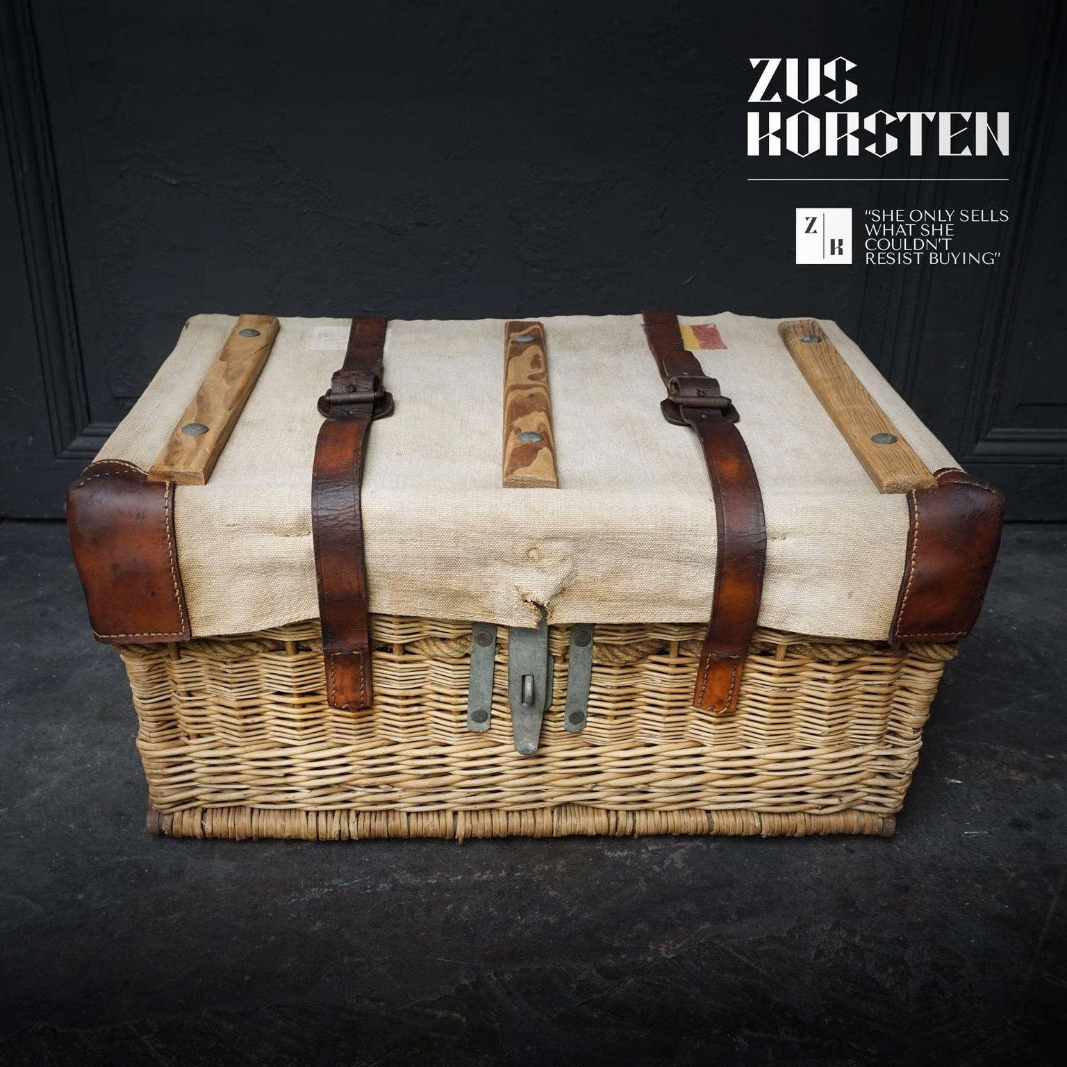 This beautiful decorative rattan trunk was used to transport mail from Belgium to Congo and back. Congo, Afrika, was a Belgian colony between 1908-1960. 

The lid is covered with water repellent coarsely woven canvas and pieces of wood so they