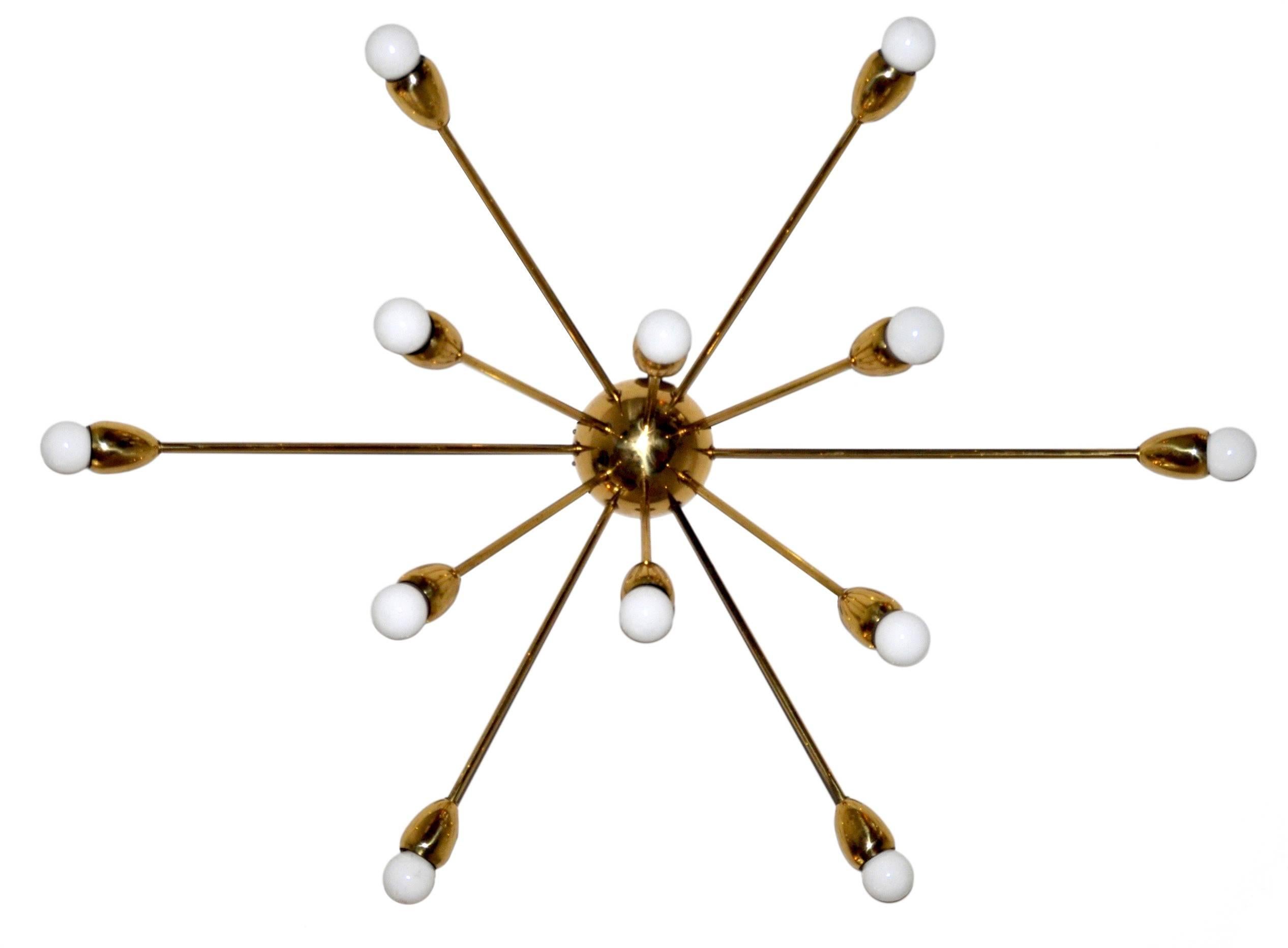 A finely tuned Sputnik flush mount with twelve arms in four varying lengths.
Each arm terminates in an elegantly formed housing of turned brass The Lamp was designed as a ceiling flush mount but can equally be used as an applique.
The lamp takes