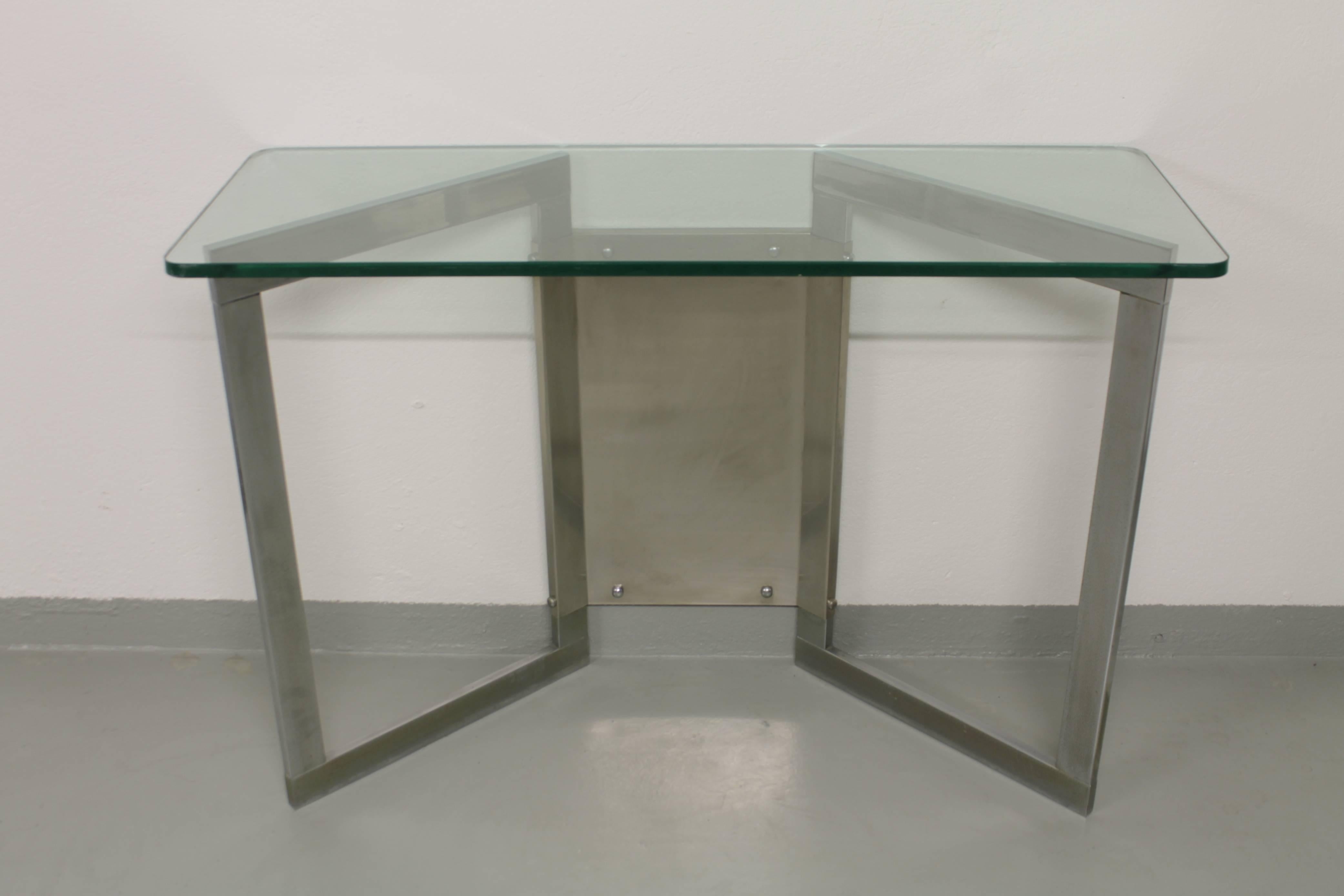 1970s thick glass and steel console.
Several traces of rust on the base (pictures).
     