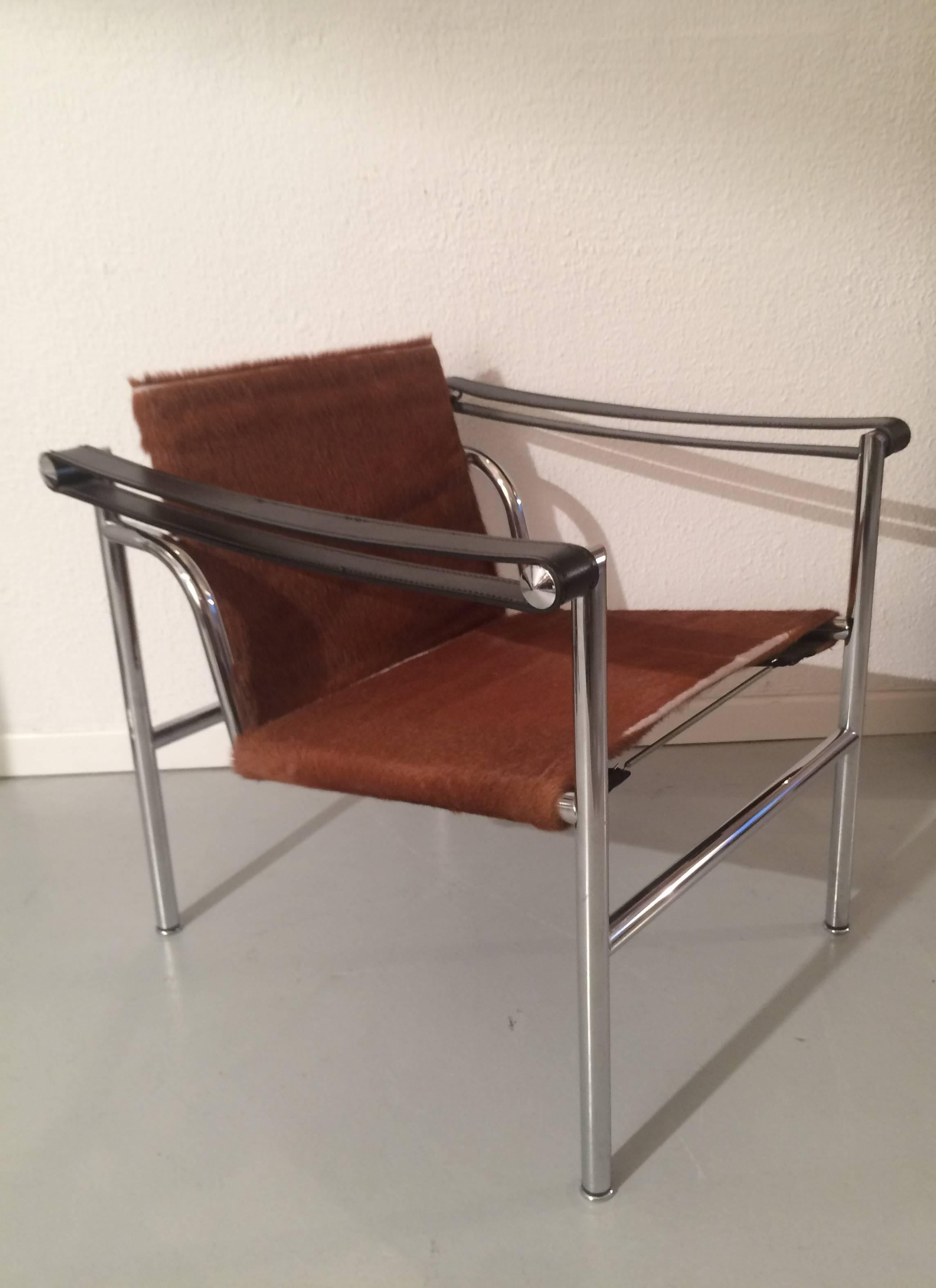 Pair of pony skin LC1 basculant chairs by Le Corbusier.
Cassina production.
Chrome in very good condition. Some misses of skin on the seat.
Signed and numeroted.
    