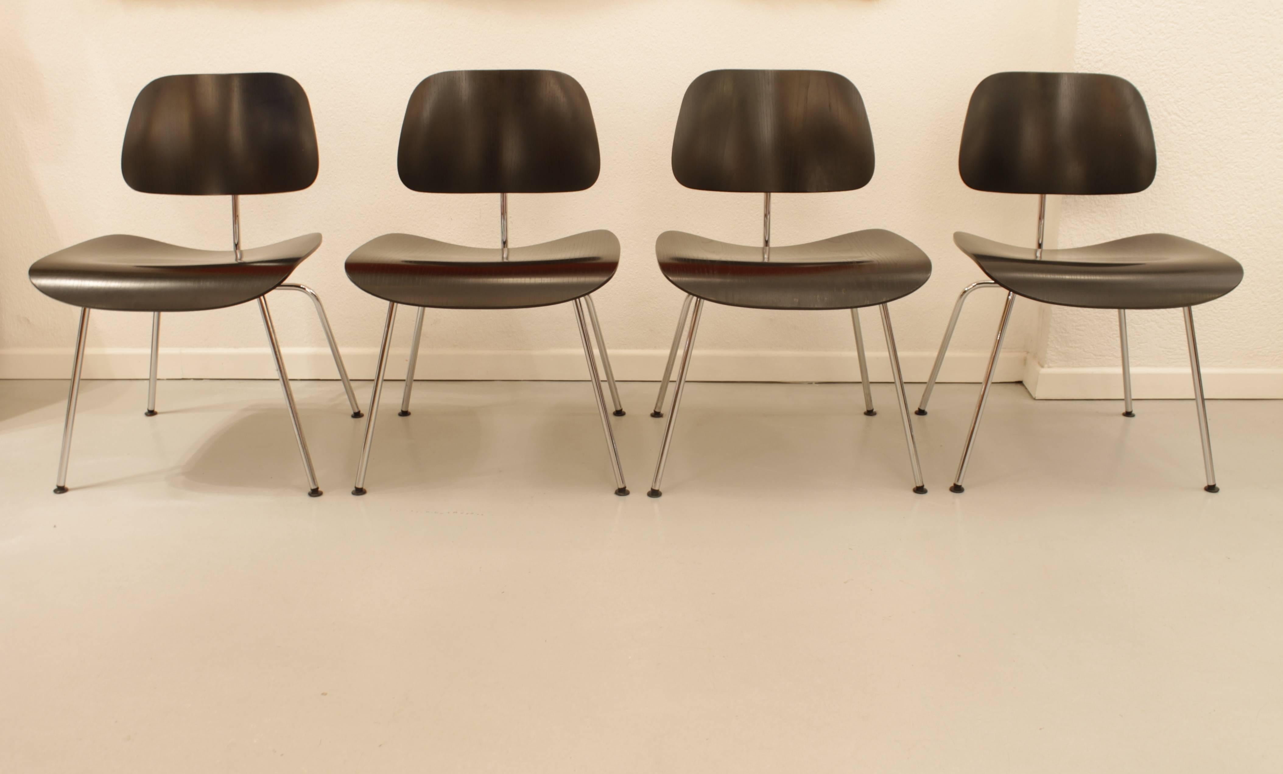 Set of four DCM dining chairs by Charles & Ray Eames
Vitra productions. Perfect condition.