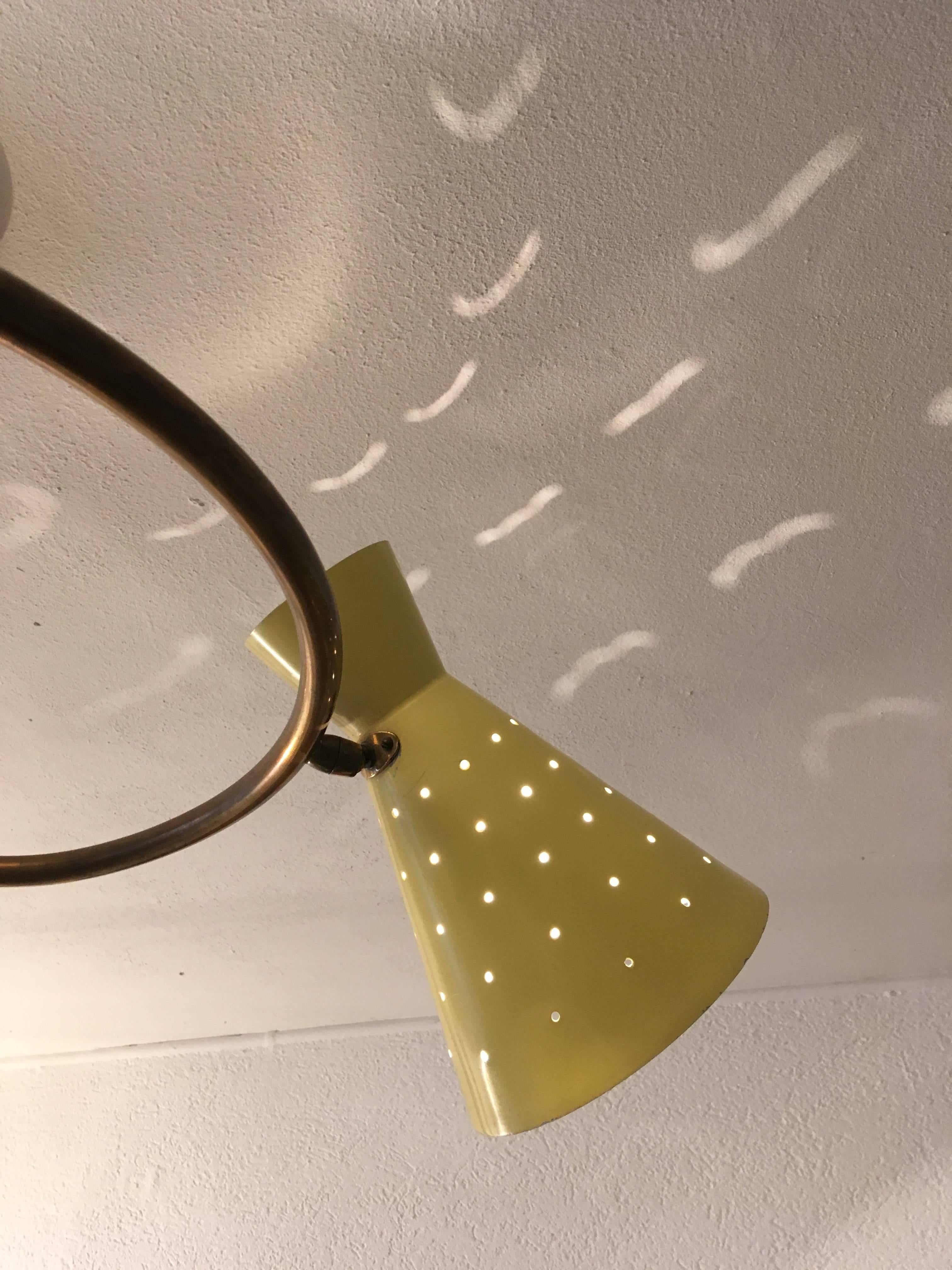 1950's ceiling or wall lamp, 3 perforated articulated shades fixed on spiral brass  stem.
A few paint losses (pictures)
