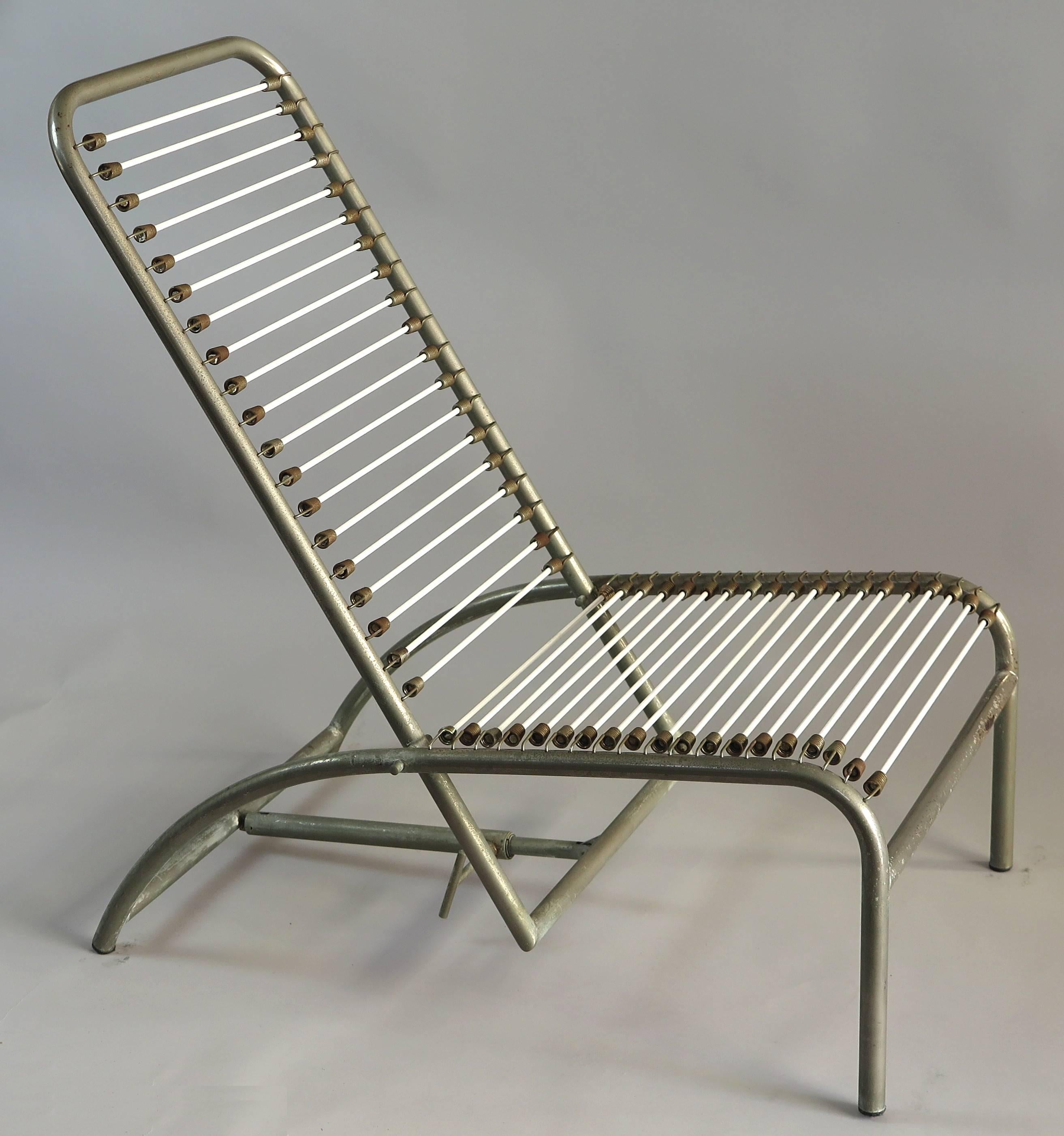 French designer and interior architect René Herbst designed in the 1920s several Sandows chairs. This comfortable chair has an adjustable back
and was produced, circa 1960, nickel-plated steel with patina. The Sandows have been replaced, as well
