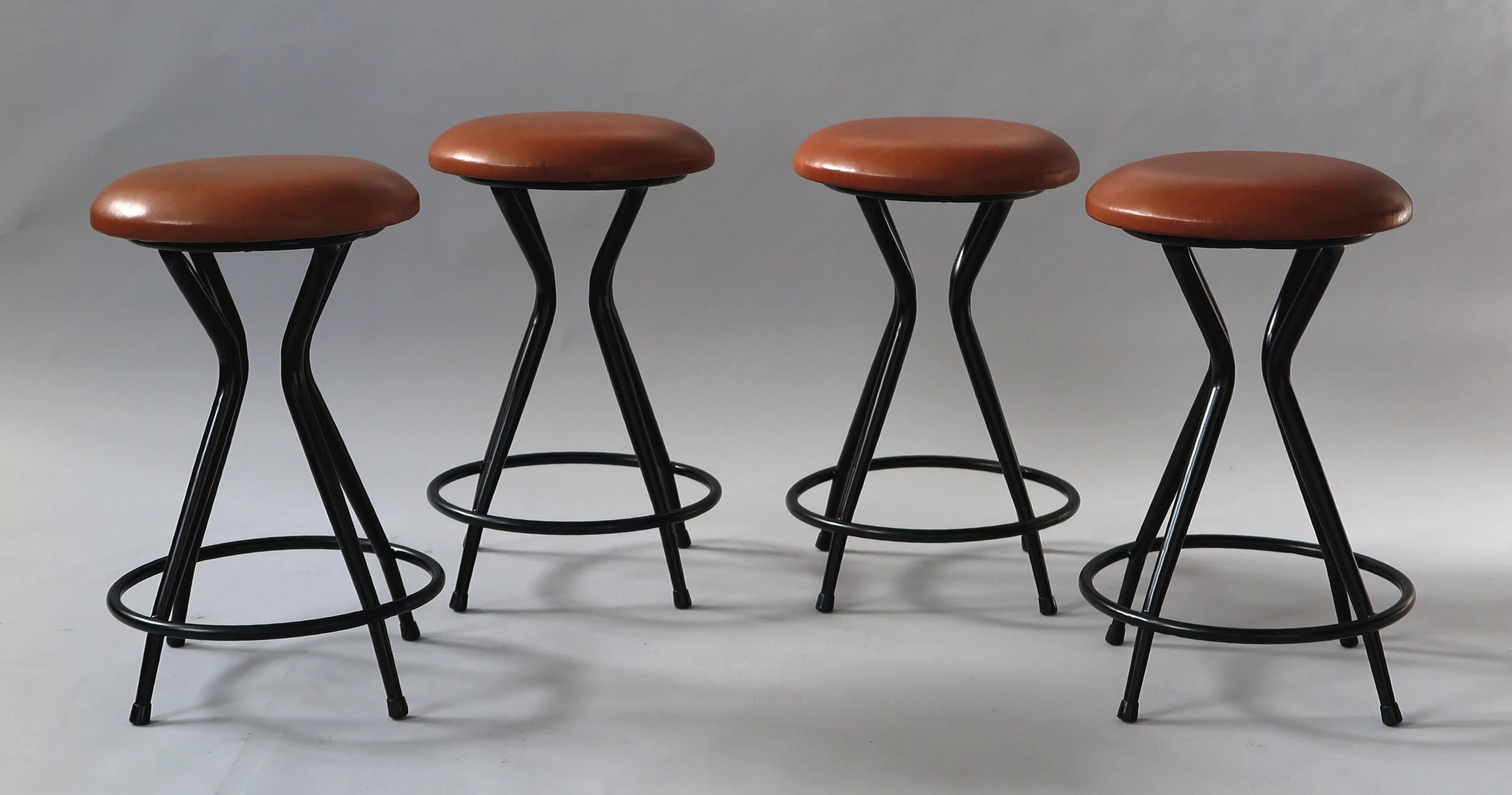 Beautiful shaped metal stools with cognac leather seat, made in Italy 1950s.
Reupholstered, bases with new lacquer.