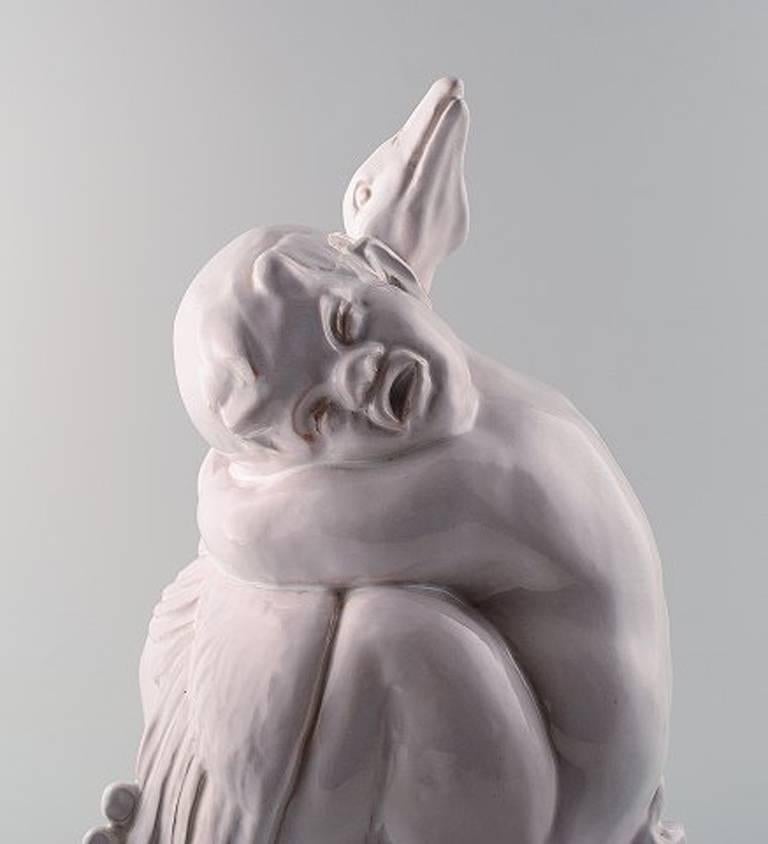 Large Hjorth 'Bornholm' glazed stoneware figure in the form of a boy / faun embracing bird.

Fine white glazed icing.

Size: 35 x 20 cm.

Signed L. Hjorth, Denmark 802 NN.

In perfect condition.