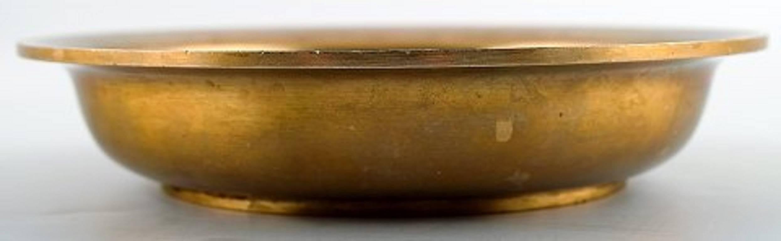Just Andersen Art Deco bronze bowl.

Marked Just, B 96.

In good condition, beautiful patina.

Measures: 17.5 cm. in diameter, 3.5 cm. height.