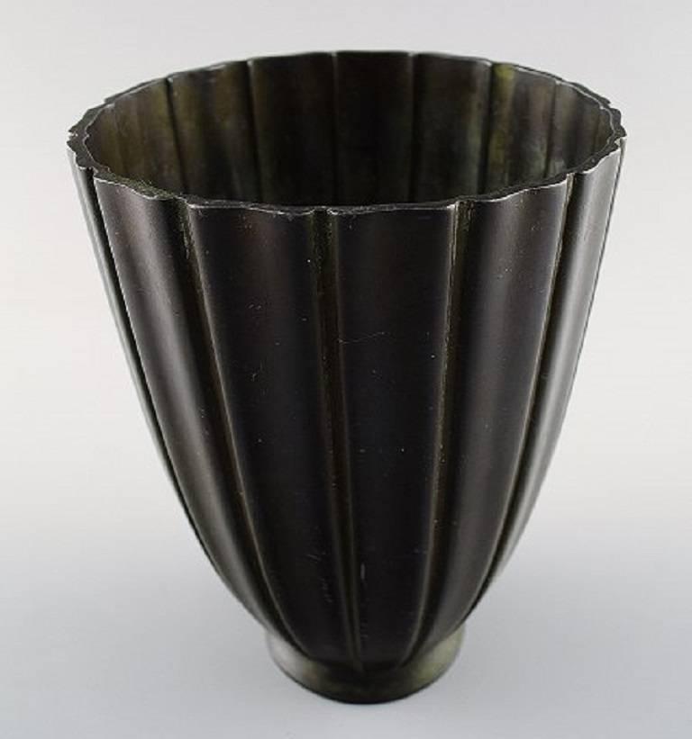 Just Andersen light bronze metal vase, model number 2363.

Marked. Good condition, minor wear.

Measures: 15 cm.