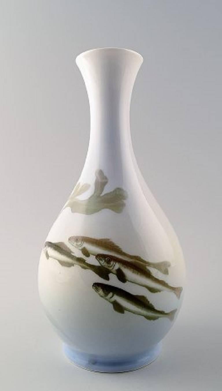 Royal Copenhagen Art Nouveau vase decorated with fish.

Measures 22 cm. Marked.

1st factory quality, in perfect condition.