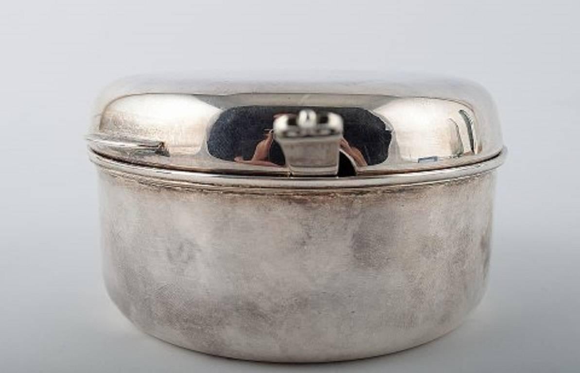 Italian Padova jar of sterling silver in contemporary design.

Evald Nielsen design number 28 silver spoon. 

A beautiful silver jar in a stylish design. 

Stamped Padova 925. Weight approx 320 gr.

In perfect condition. Height 6 cm.