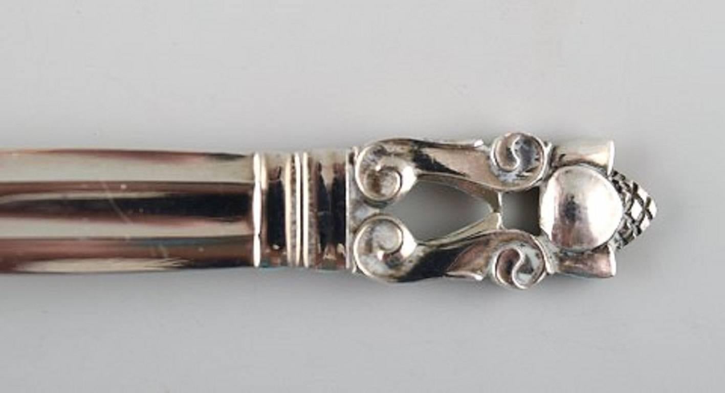 Seven Georg Jensen sterling silver Acorn spoons. 

Flatware, vintage spoons in Acorn.

Measures: Length 19 cm.

Stamped, Georg Jensen sterling Denmark.

Good used condition.
