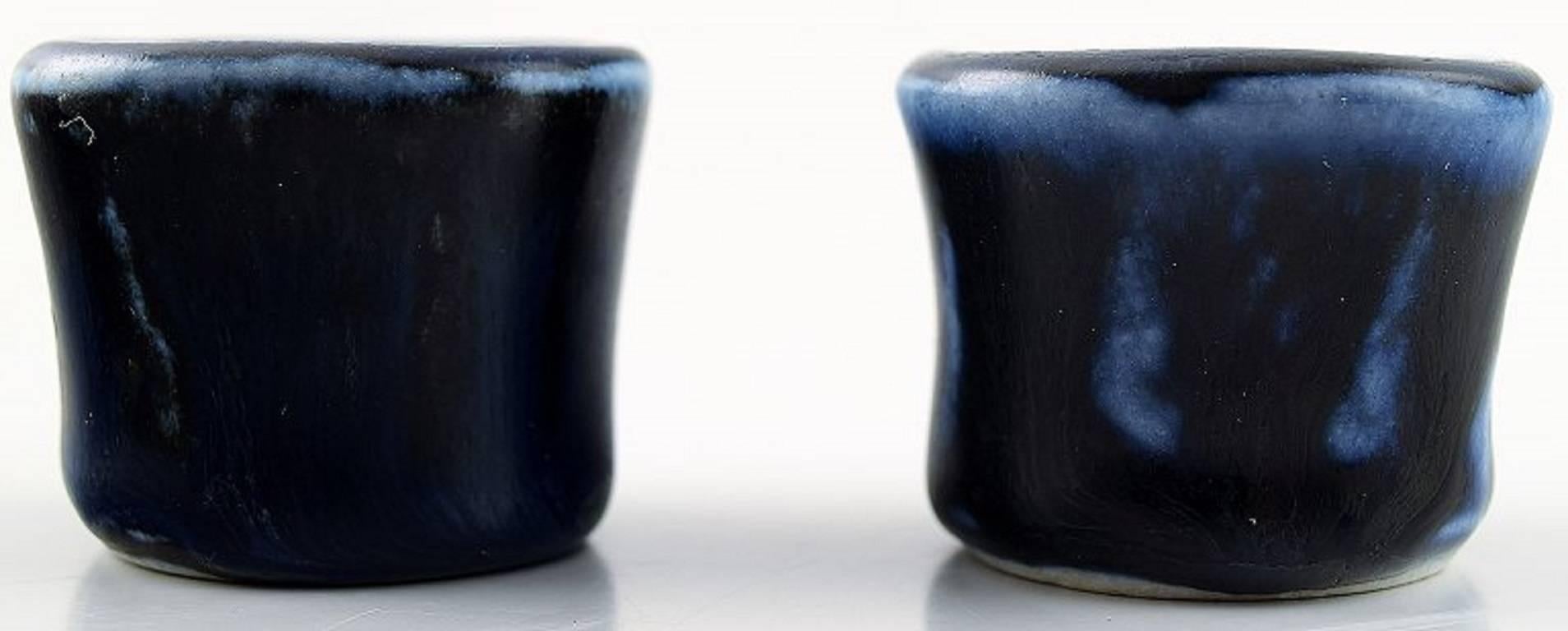 Edith Sonne for Saxbo pair of candlesticks, art pottery.

Stamped with Yin Yang, Denmark, mid-20 century.

Glaze in dark blue shades.

Measures 3.3 cm.

In perfect condition.