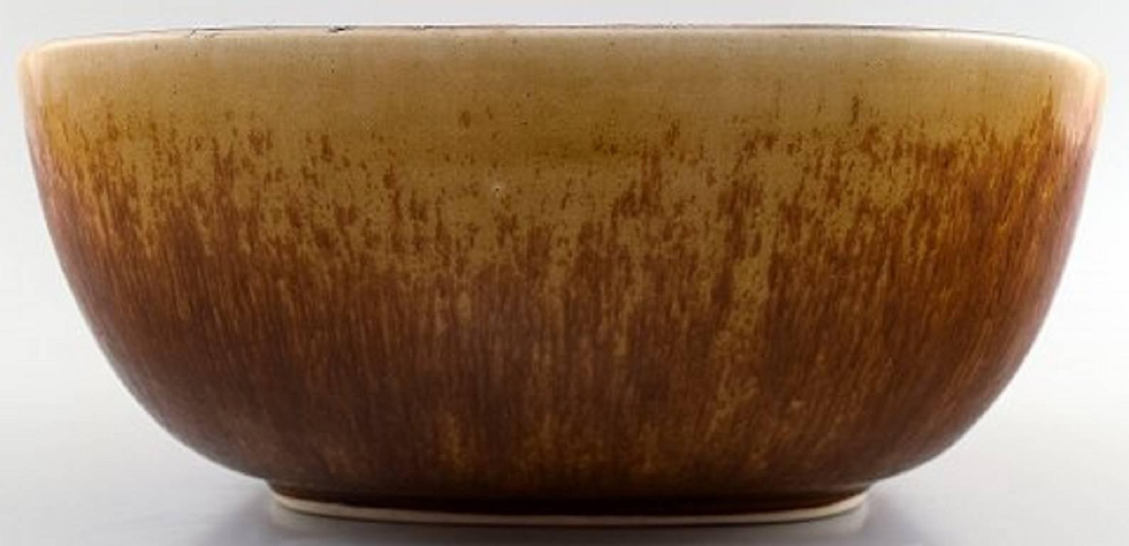 Eva Staehr Nielsen for Saxbo, ceramic bowl in modern design.

Beautiful glaze in blue and green tones inside. 

Earth tones on the outside.

Marked.

Measures: 18 x 7.5 cm.

In perfect condition.