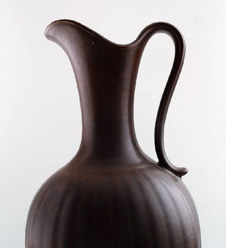 Gunnar Nylund for Rörstrand vase or pitcher in ceramics.

Beautiful glaze in shades of brown.

In perfect condition.

Measures: 45 cm high.

Marked.