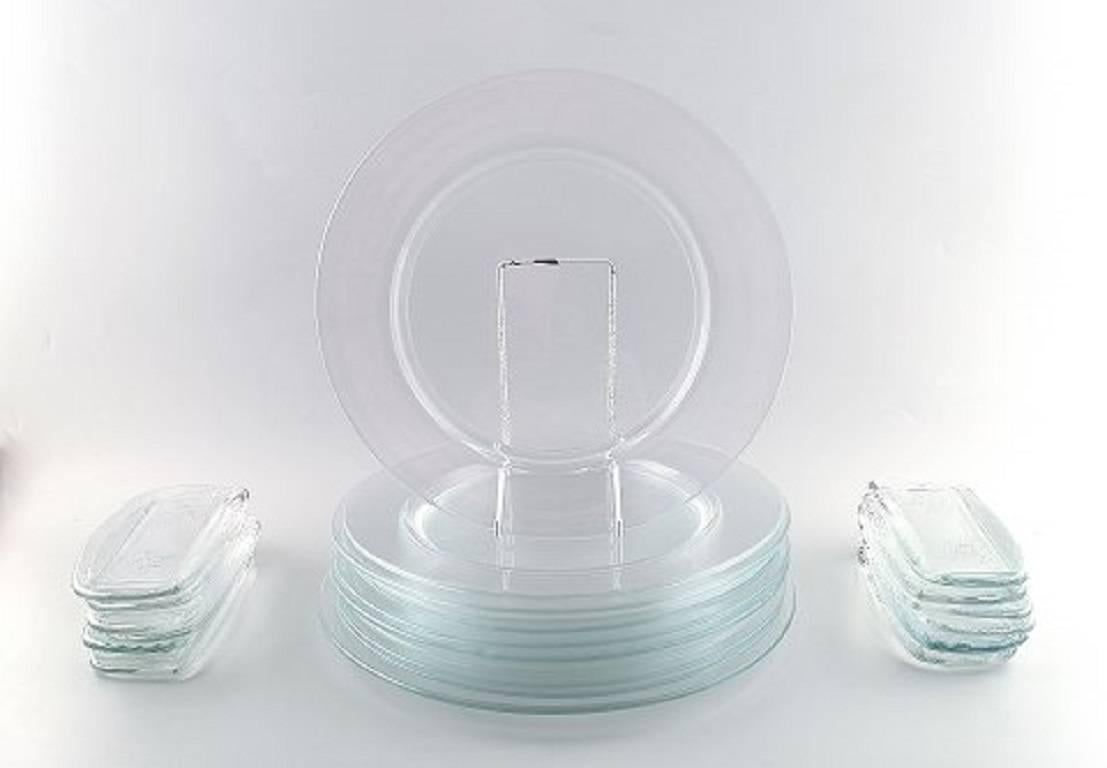 Reijmyre glassworks, "Operakällaren" art glass 12 cover plates, 12 pcs. bread or tapas or sushi dishes.

Sweden 1980s.

Measures: cover plate 30 cm, bread plate 22 cm. long.

In perfect condition.

Unstamped.