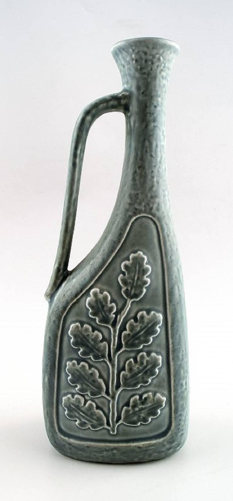 Large Rörstrand ceramic vase / pitcher,

Sweden, 1960s.

Beautiful glaze in shades of green.

Measures: 28.5 cm.

Perfect condition.

Marked.