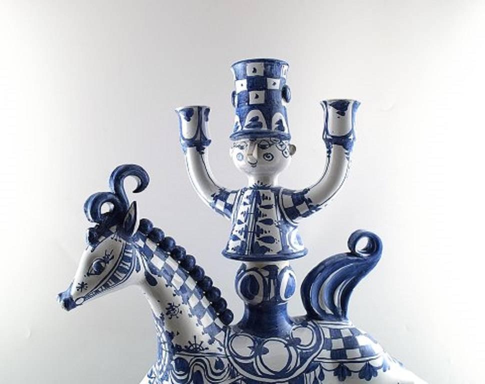 Huge Bjorn Wiinblad figure from the blue house.

Figure/candlestick rider on horseback for three lights.

Decoration number L22.

This is made in 1972.

Measure: Height 62 cm., length 50 cm.

Perfect condition.