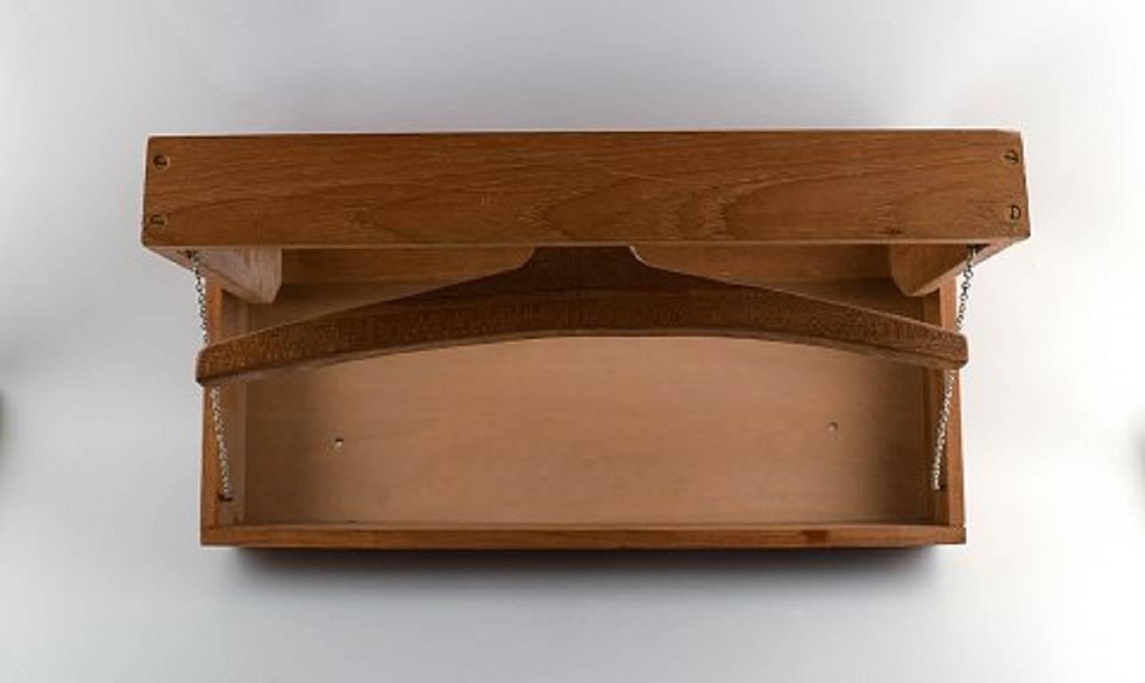 Wall valet in oak and brown leather designed by Adam Hoff & Poul Østergaard.

Produced by Virum Møbelsnedkeri in Denmark.

Condition: Very good, small crack.

Height: 11.02 in. (28 cm)

Width: 22.05 in. (56 cm)

Date of manufacture: