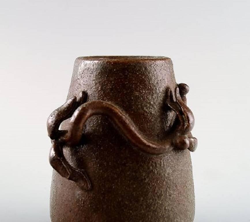 Arne Bang. Pottery vase with foliage.

Stamped AB. Number 185.

Glaze in shades of brown.

In perfect condition.

Measures: 9 cm. x 6 cm,

Denmark, 1940s.
  