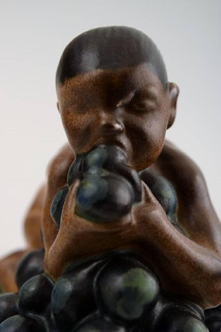 Danish Bing & Grondahl, Stoneware Figurine of Boy with Bunch of Grapes by Kai Nielsen